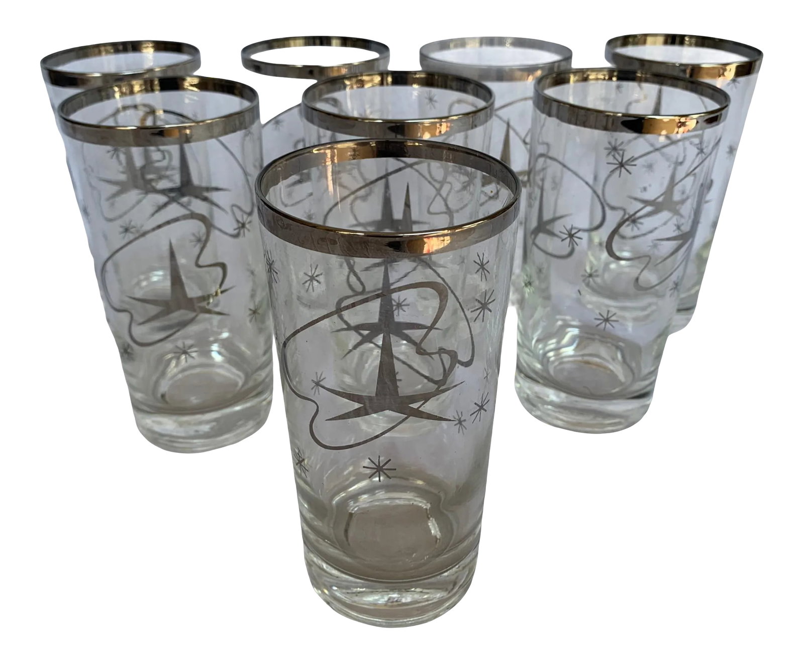 Mid 20th Century Modern Atomic Cocktail Glasses- Set of 8: Set of 8 mid-century modern atomic cocktail glasses. Each one features a motif of silver sunburst and stars. BoxA4 Condition: Alterations: Original Condition Unaltered Imperfections: Some Imperfection