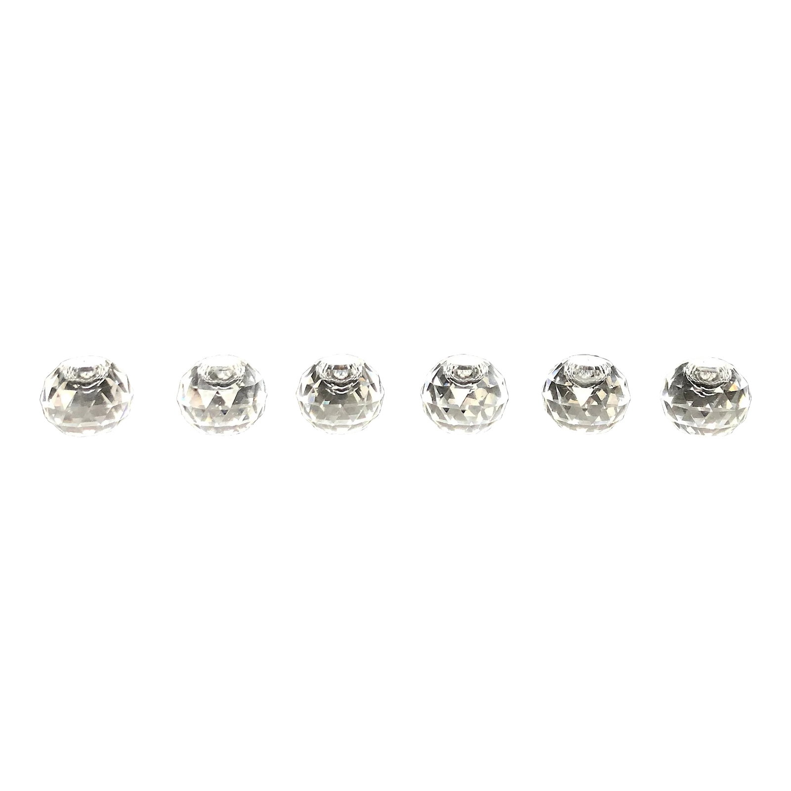 Vintage Miniature Cut Glass Crystal Can6dleholder Set Of: Sparkling little gems, use these miniature cut crystal candle holders on a dining table as a part of a centerpiece or on a living room console as decor. Measuring a mere 1 1/8" x 1", these tiny