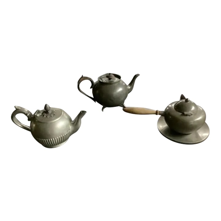 Antique English and American Pewter Teapots Set- 4 Pieces: Beautiful and sweet set of three antique pewter tea/hot pots: One with small tray and wooden handle, marked Lunning Inc. (American) Largest one, a bit darker pewter color, marked Philip Ashberry &