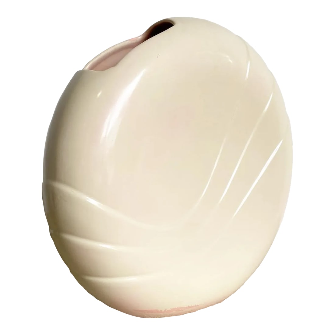 Postmodern Circular Cream Vase by Haeger: The Postmodern Circular Cream Vase by Haeger serves as both a functional object and a piece of art. Its smooth, circular design evokes a sense of balance and harmony, a characteristic that is often