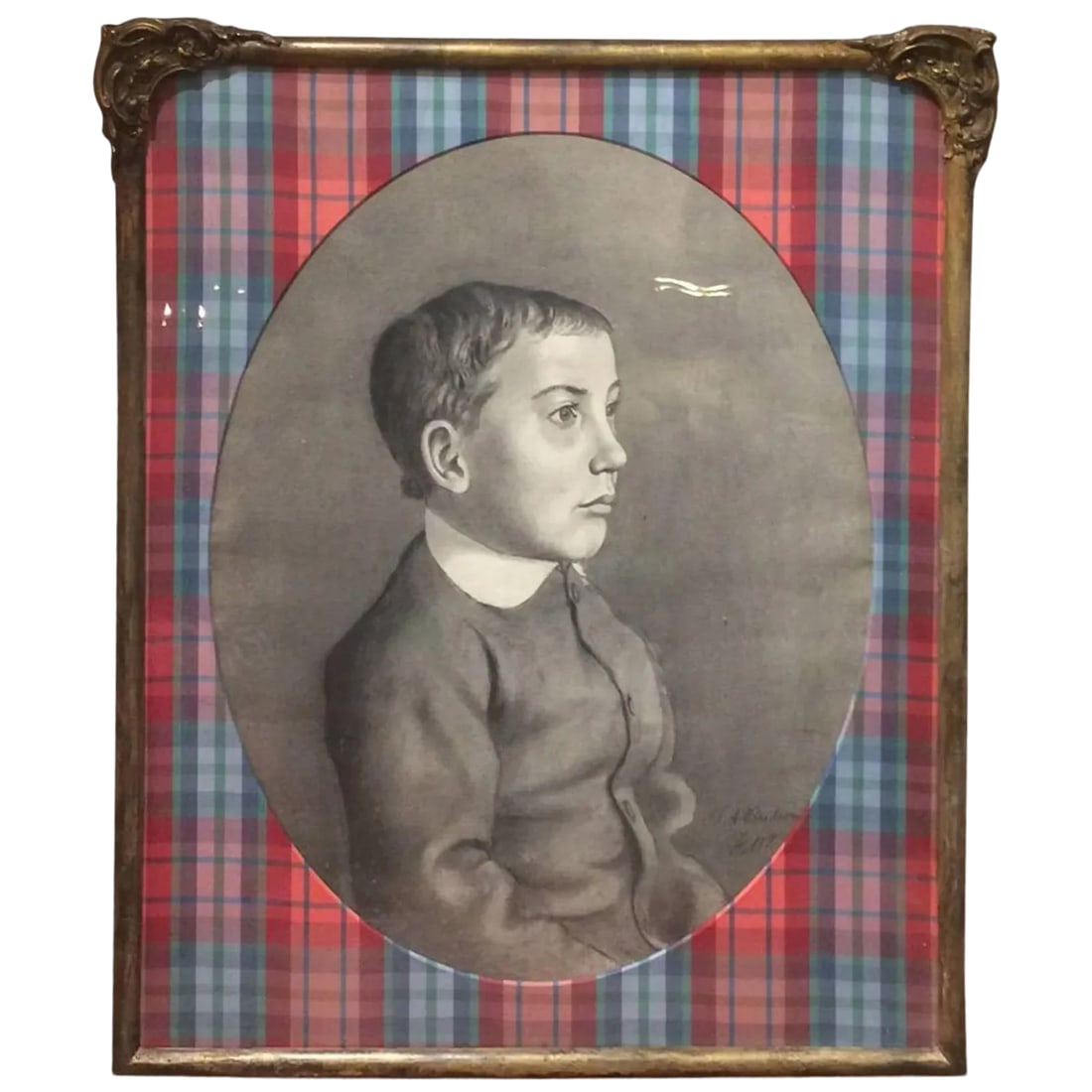 Framed and Matted Charcoal Portrait of a Boy: 19th century charcoal portrait of a pensive little boy imaginatively matted as an oval surrounded by fancy plaid taffeta and a vintage giltwood frame with original wavy glass. Signed lower right L A B