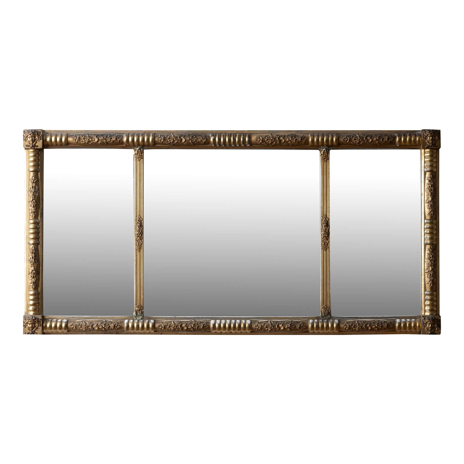 Gilt Overmantel Mirror, 19th Century: A gilt overmantel mirror, mid-19th century. Featuring a split baluster frame with figural bacchante corner blocks and divided mirror plate. 43 1/2 by 21 1/2 inches Condition: Alterations: Original