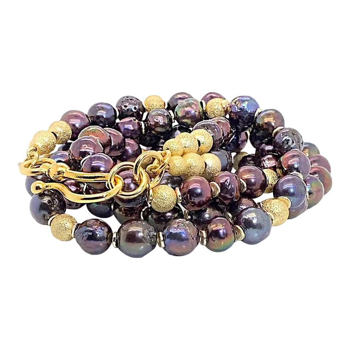 Two Strand Iridescent Mauve Pearl Necklace With Goldy Accents: This is part of Chairish's Fine Jewelry assortment. Elevate your style with this elegant two-strand necklace featuring stunning mauve iridescent pearls accented with frosted goldy beads. Measuring 23