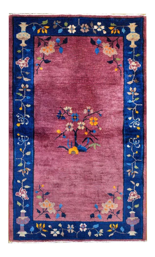 Chinese Art Deco Rug: A beautiful early 20th century Chinese Art Deco rug with a rich lavender field surrounded by a wide indigo stripe border. The field features a blossoming cherry blossom tree in the center with a