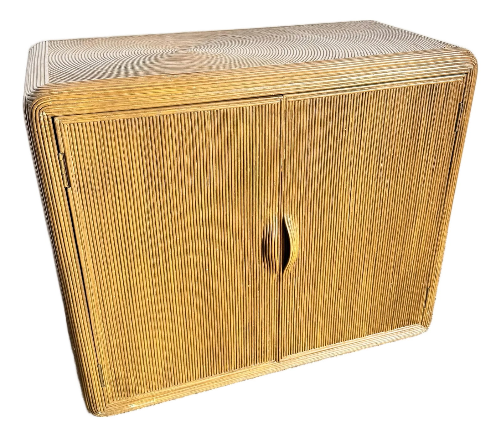 Boho Chic Swirl Pencil Reed Sideboard/Cabinet: A beautifully crafted Boho Chic sideboard featuring an intricate swirl pencil reed design across its rounded frame and double doors. The natural rattan texture gives this cabinet a warm, organic