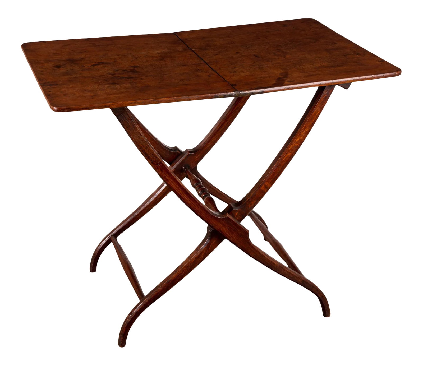 Regency Oak Coaching Table: An English oak folding coaching table from the Regency period. A hinged rectangular top folds with curved and chamfored legs and turned stretchers between. The coaching table was designed to be