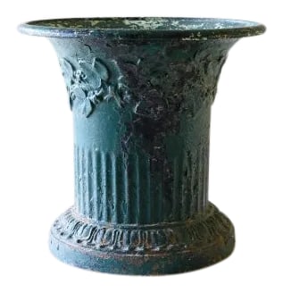 19th Century Iron Jasmin Planter Urn: IRON JASMIN VASE - vase jasmin en fonte This heavy urn served as a planter to rotating plants on an outdoor table. Date: circa 1830 Dimensions: 12 inches tall, 14 inch diameter Provenance: chateau out