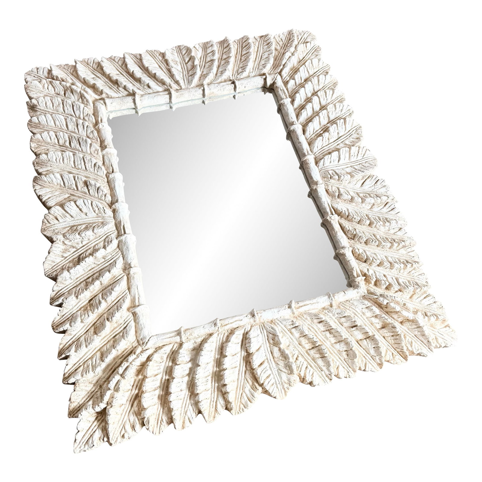 Vintage Boho Chic Faux Bamboo and Banana Leaf Wall Mirror: This vintage Boho Chic wall mirror features a sculptural faux bamboo and banana leaf motif, richly textured to evoke the relaxed glamour of classic Florida interiors. The casted leaf pattern frames th