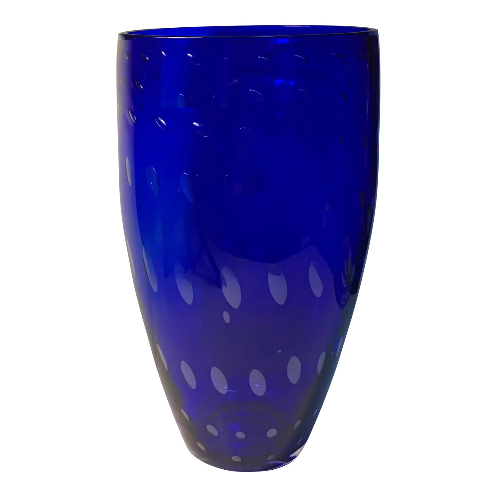 Bullicante Cobalt Blue Art Glass Vase: This 11-inch art glass vase is a refined example of mid-century modern design, blending clean lines with subtle, deliberate detail. Hand-blown by skilled artisans, it features a gently tapered cylindr