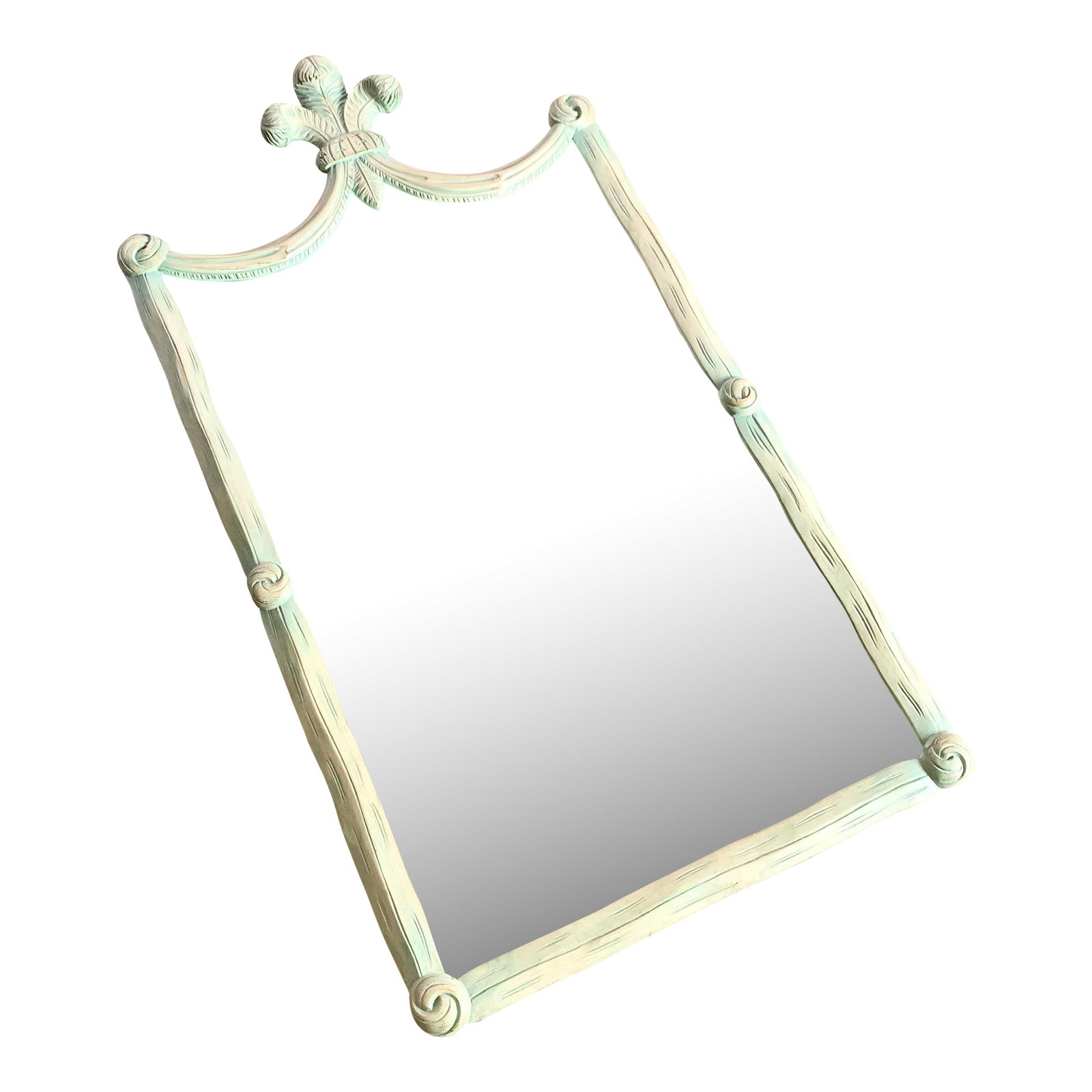 Vintage Regency Painted Green Wooden Mirror: This vintage Regency-style mirror features a carved wooden frame painted in a soft green with delicate distressing for timeless charm. The ornate crest, crowned with a fleur-de-lis, and gently