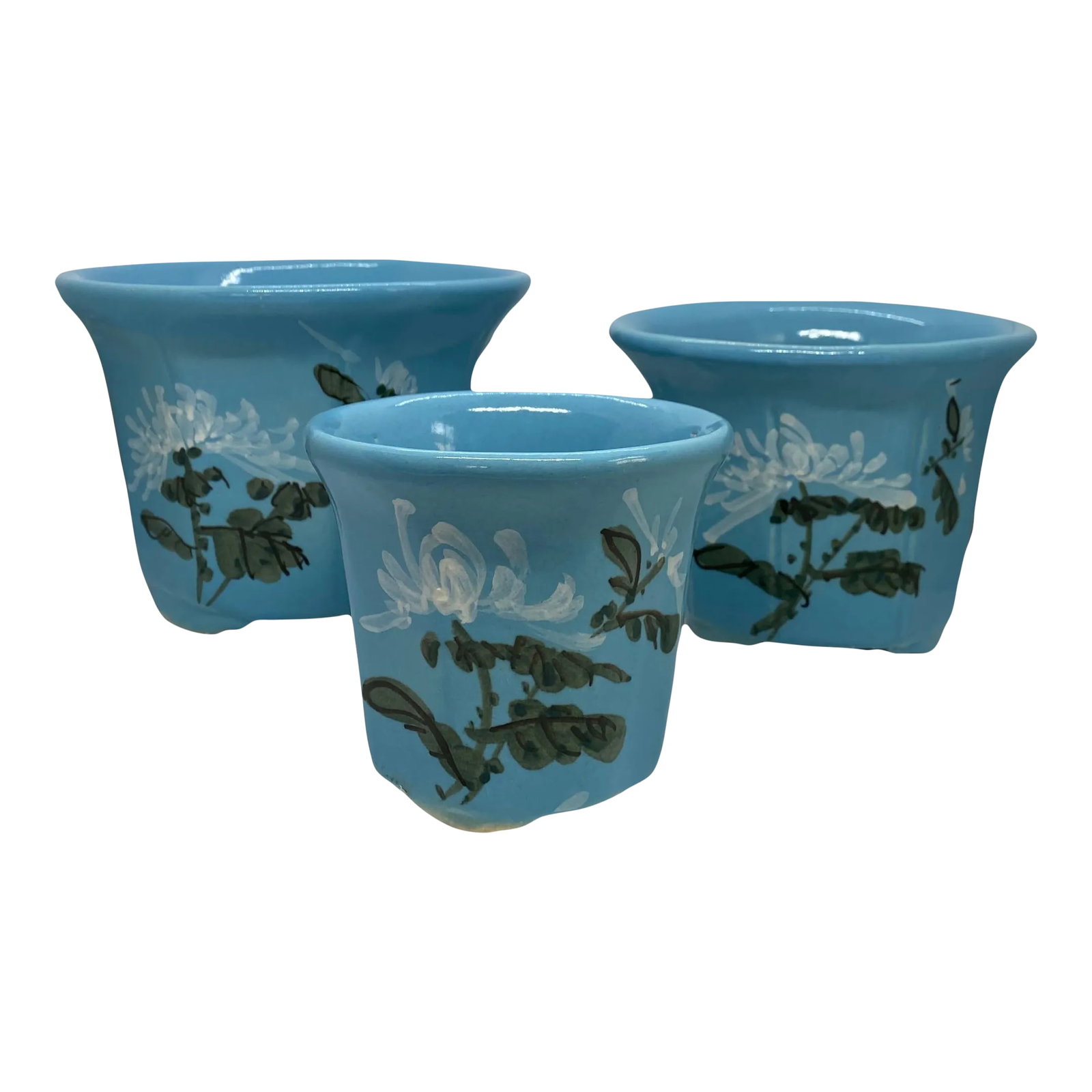 Mid 20th Century HandPainted French Blue Ceramic Planter Flower Pots - Set of 3: Beautiful Set of Three Mid 20th Century HandPainted French Blue Ceramic Planter Flower Pots. This set includes a small, medium and large planters. Each has a shiny overglaze and each has a white flora