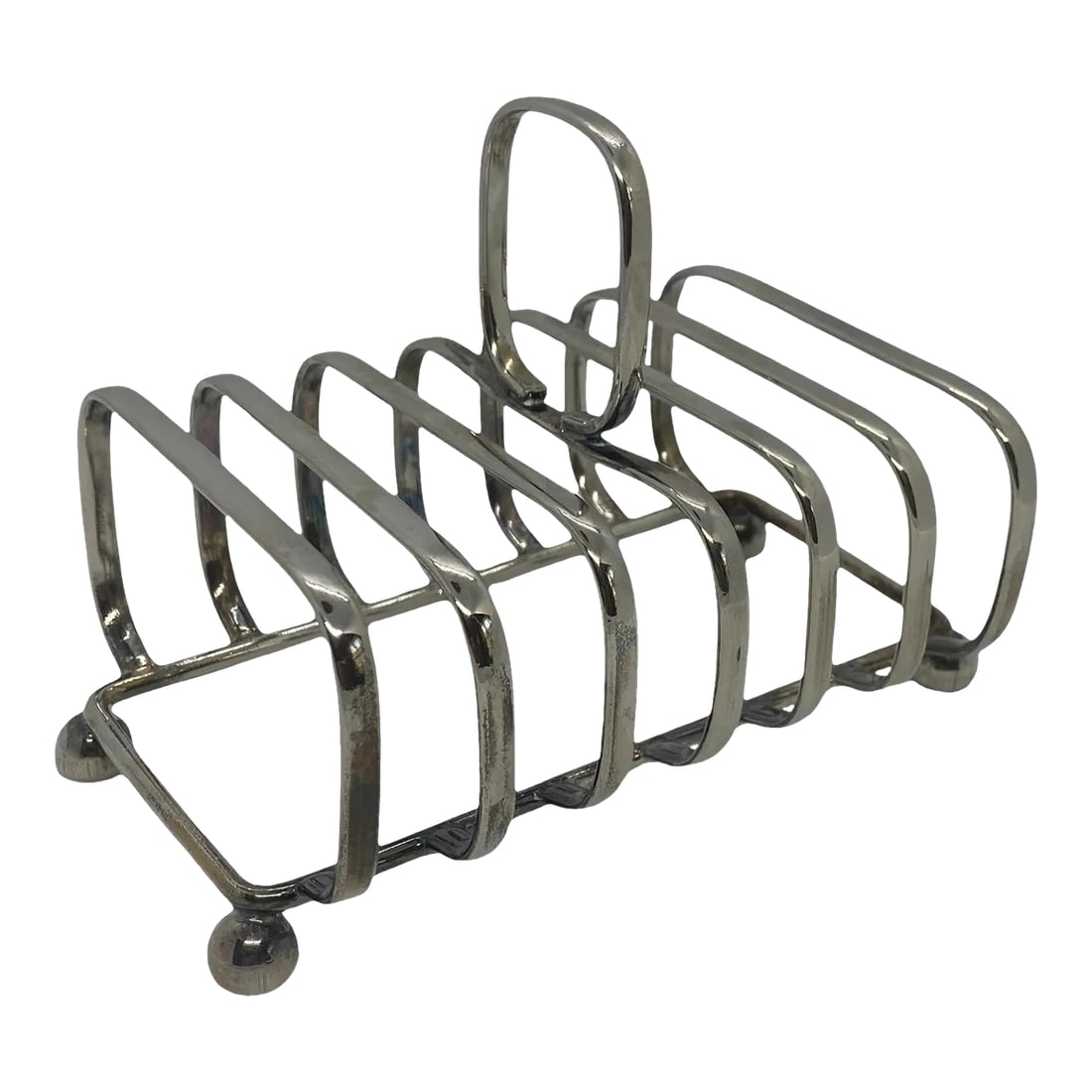 Mid 20th Century Silver Plate Toast Rack: Mid 20th Century Silver Plate Toast Rack. This lovely Rack is in excellent condition with minor scratches as a result of age and normal use. There is a Maker's Mark but it is very difficult to read