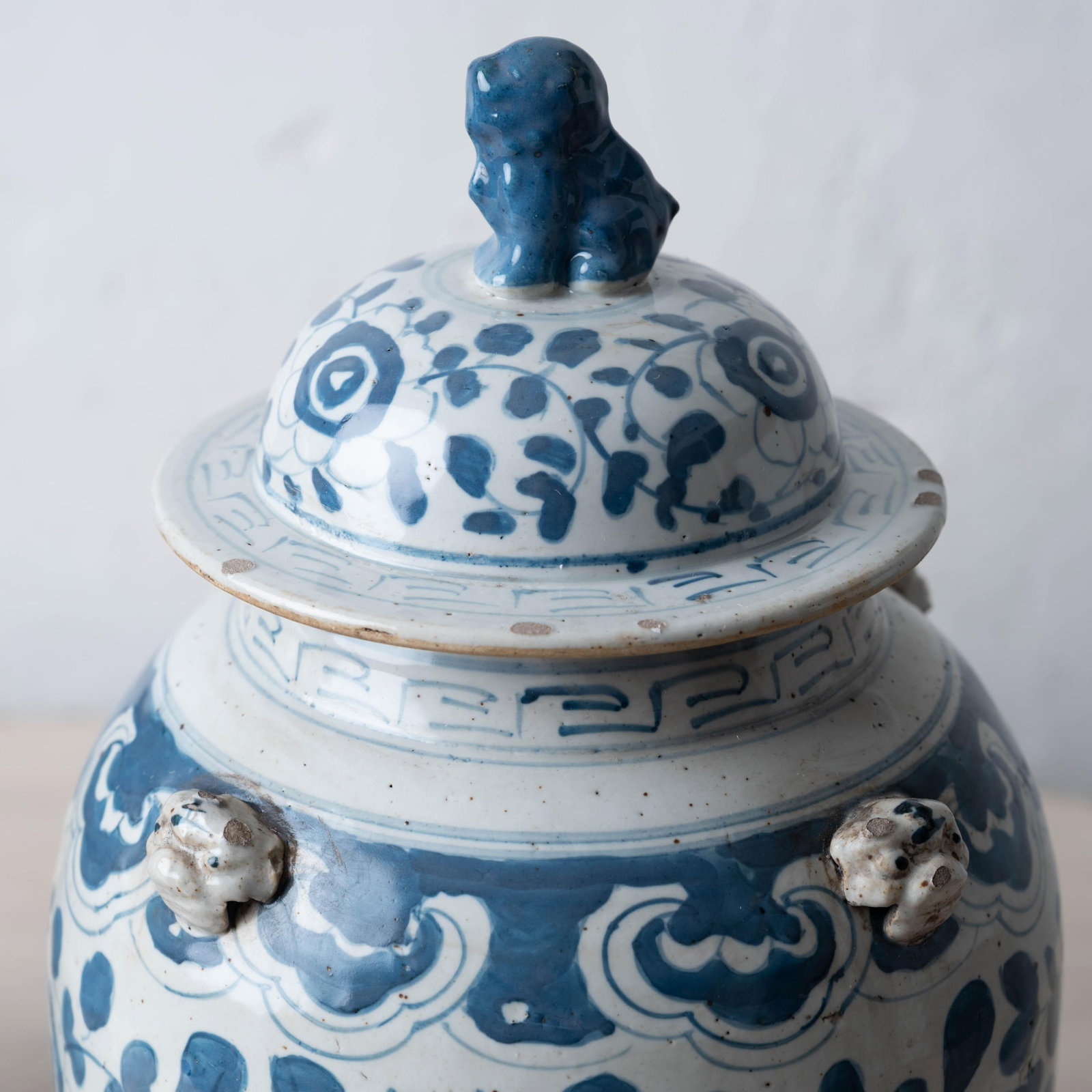 Pair of Chinese Blue and White Glazed Jars With Foo Dog Finials - 3