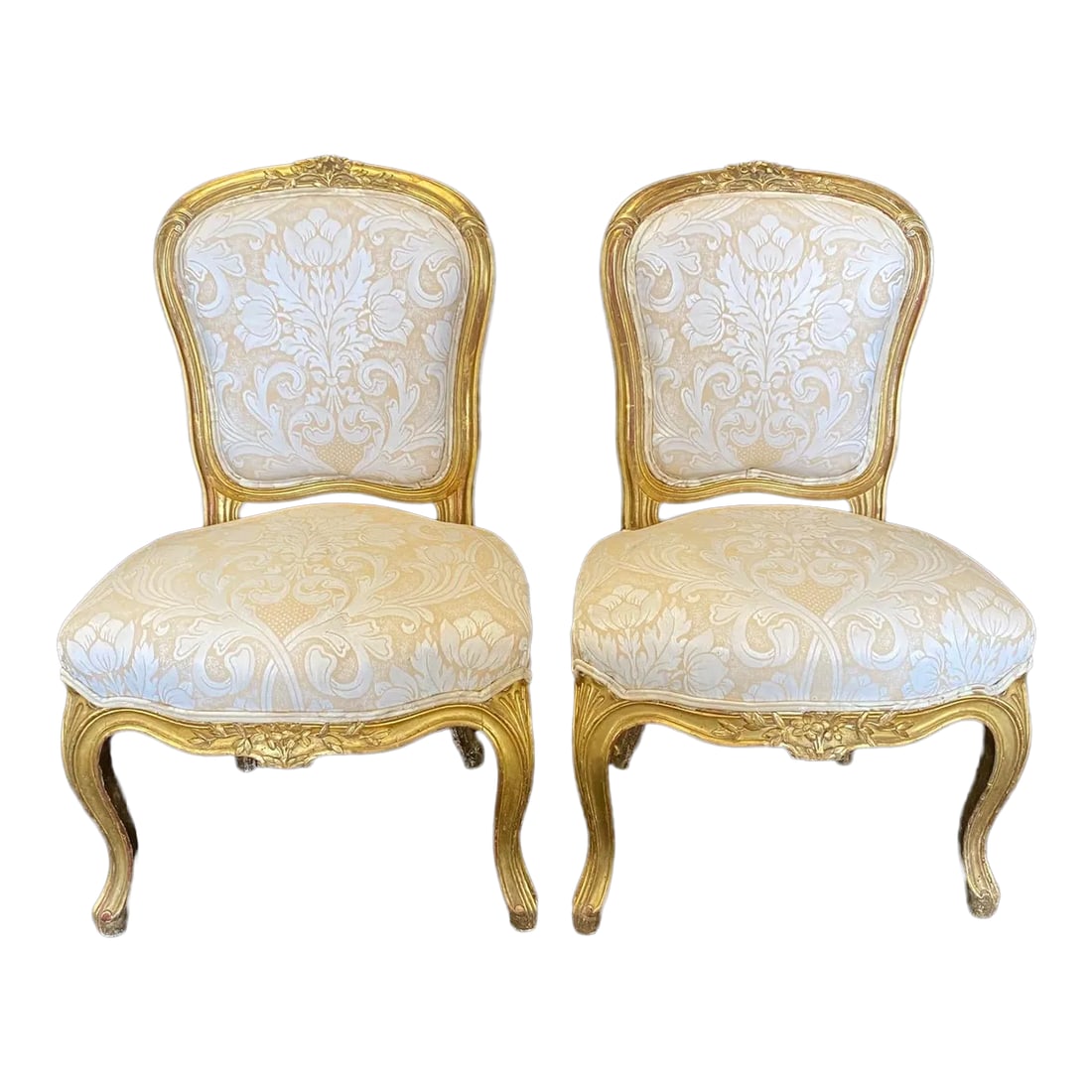 French Louis XV Gold Slipper Chairs -A Pair: Really lovely pair of French Louis XV giltwood antique slipper chairs with intricate floral carving on the apron and top of backrest. The single window pane on the back is a nice touch. #2255