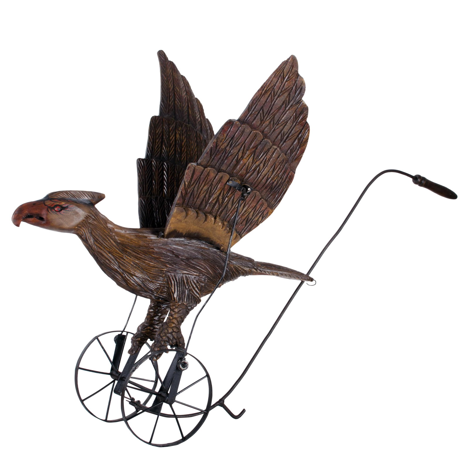 Mechanical Eagle Push Toy: American carved and painted eagle push toy, 20th century. Wrought iron frame mechanism in good working condition. Pushing flaps the wings in a very natural movement. Crack on the right flank of the