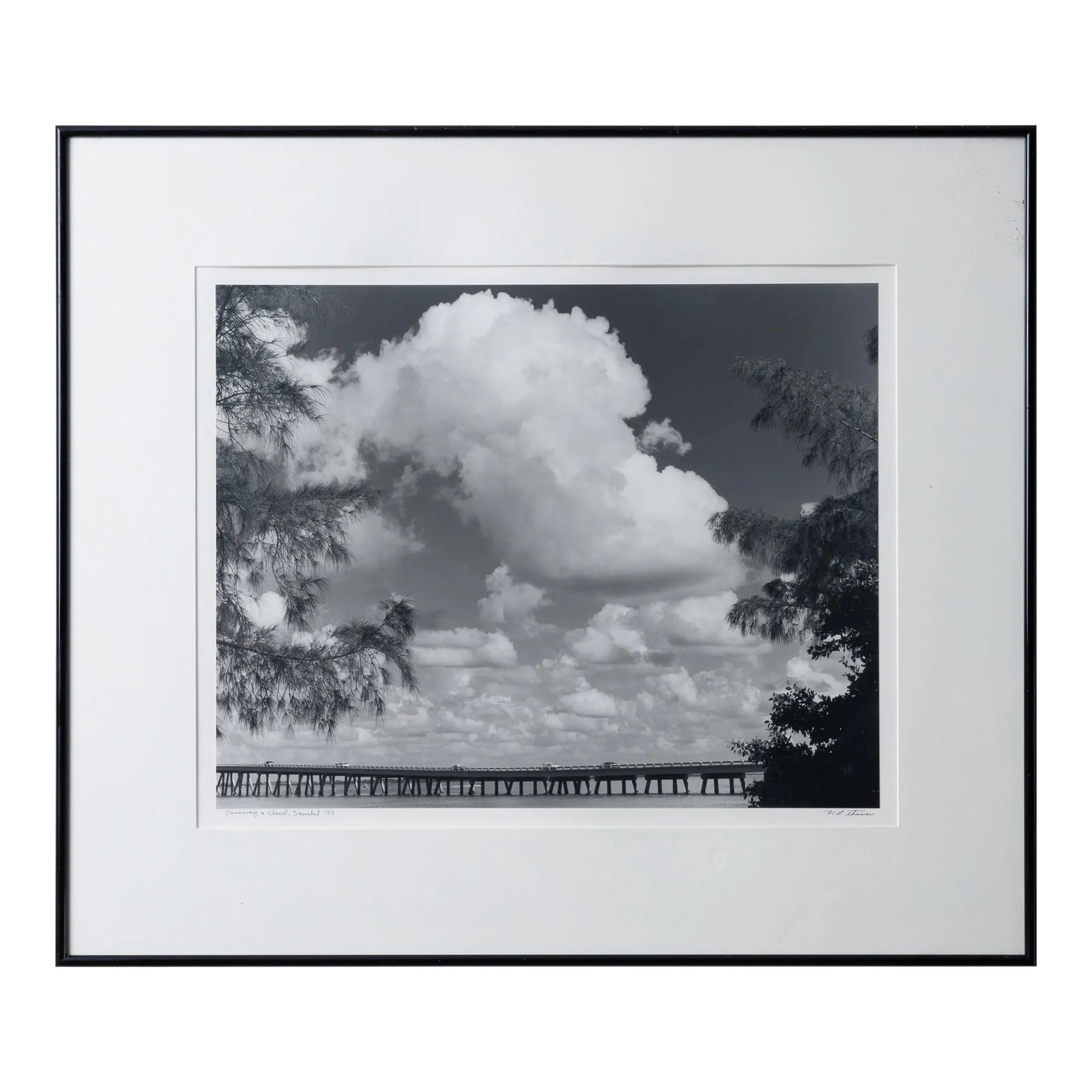 William L. Thomas Sanibel Island Silver Gelatin Photograph: William L. Thomas Causeway & Cloud, 1995 silver gelatin titled and signed sight: 20 by 16 inches frame: 28 by 24 inches William L. Thomas began his photographic career after studying under Ansel Adams