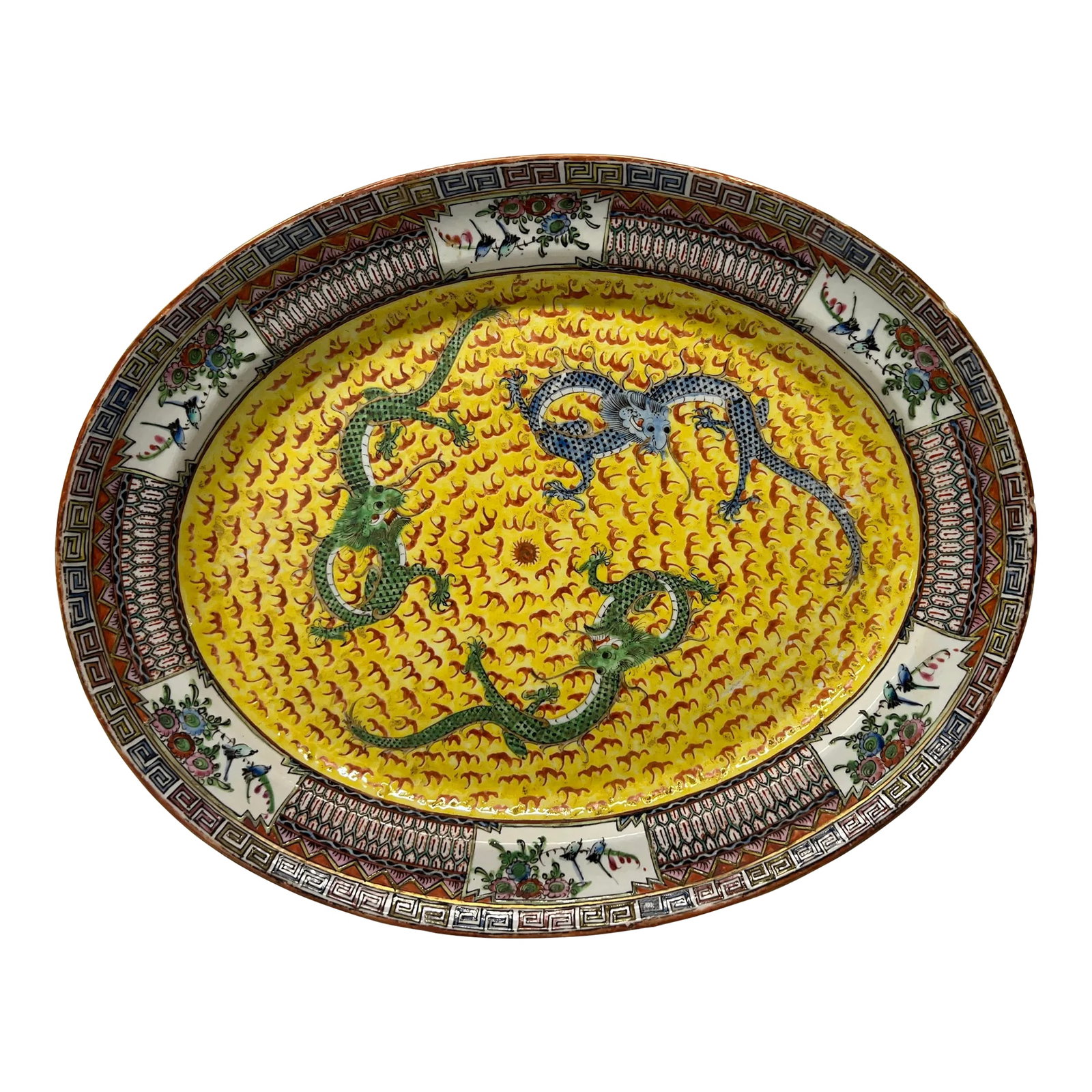 19th Century, Chinese Export Famille Jaune Imperial Dragon Platter: Chinese, early to mid 19th century. An antique famille jaune platter decorated with 3 imperial dragons chasing the central pearl. A good quality enameled edge with greek key style bordering. Marked
