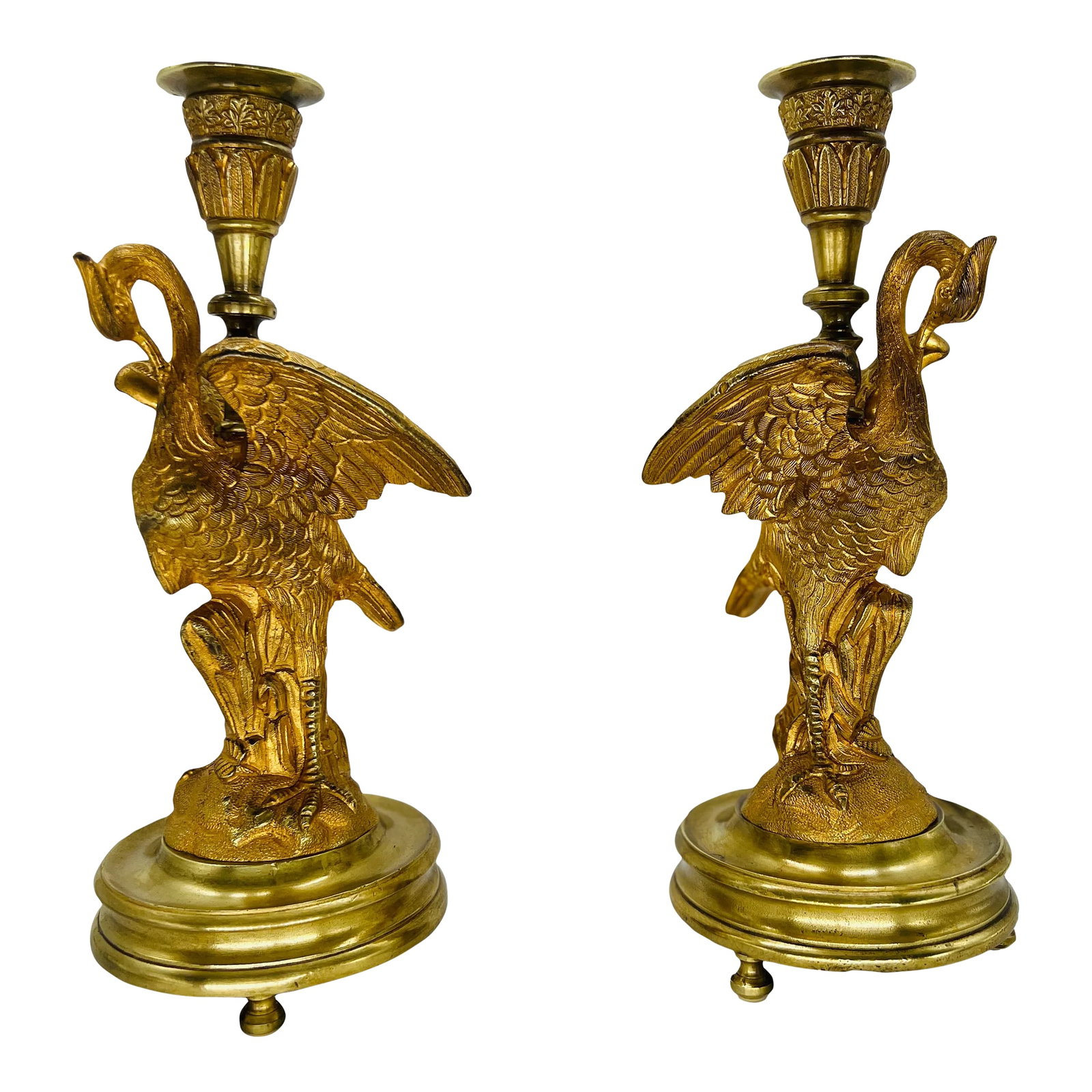 Pair, French Empire Gilt Bronze Crane Motif Candlesticks Circa 1815: French, circa 1815. This exquisite pair of French Empire gilt bronze candlesticks, crafted circa 1815, embodies the opulence and grandeur of the Empire style. Each candlestick features a graceful