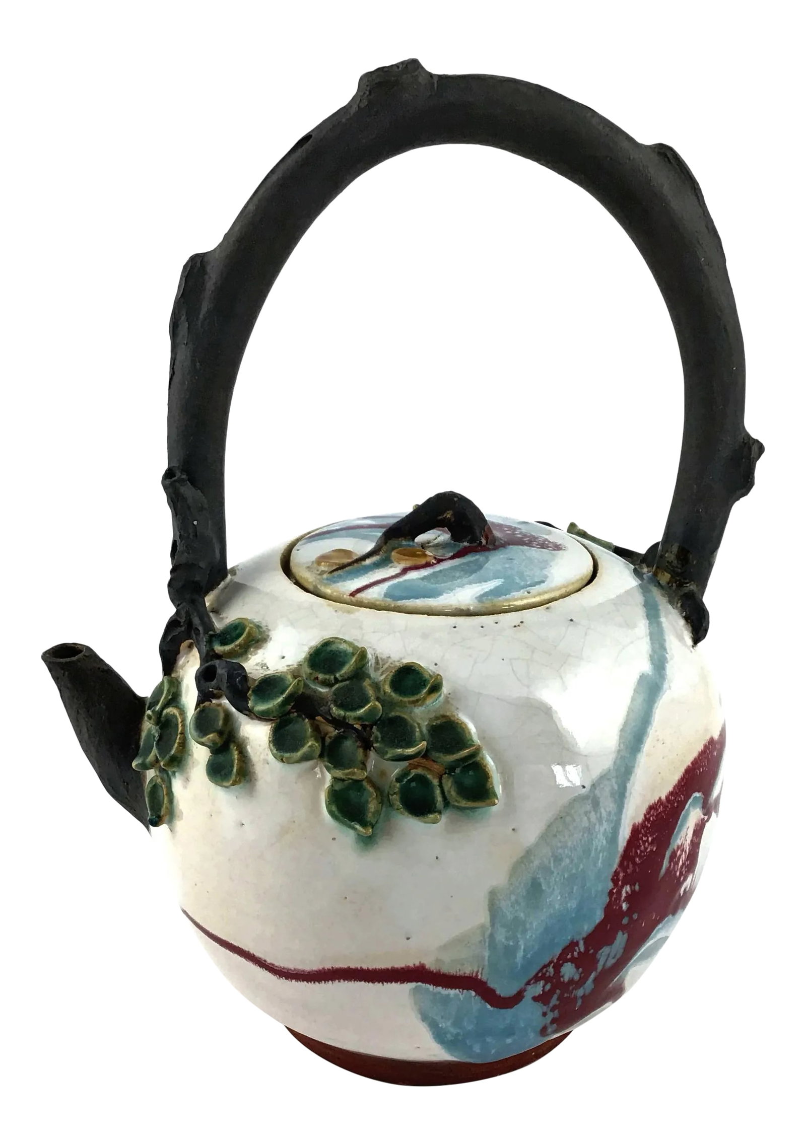 Artisanal Antique Thai Ceramic Teapot: Such a special design. The handle looks like a tree branch. The leaves on the outside of the base of the teapot are three dimensional. The glazing has gorgeous colors of blue and burgundy. Signed and