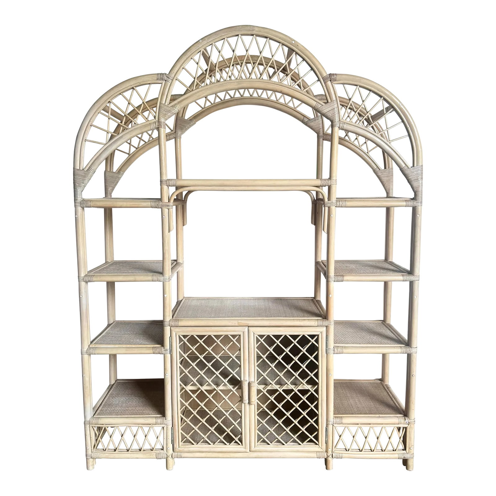 Boho Chic Blonde Rattan Arched Top Etagere: Embrace the elegance of Florida's historic charm with this Boho Chic Blonde Rattan Arched Top Etagere. Crafted with intricate rattan weaving, this stunning piece features an arched top and multiple