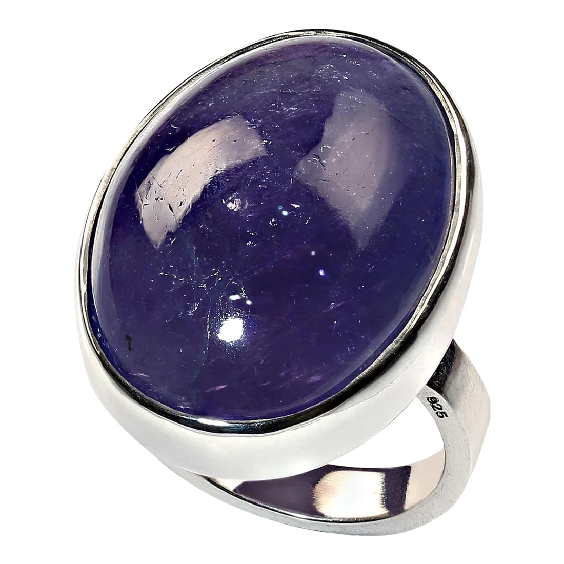 Tanzanite Oval Cabochon in Sterling Silver Ring Size 7.5: Exquisite 50 Carat Oval Tanzanite in Handmade Sterling Silver Bezel Setting Discover the beauty and rarity of Tanzanite with this magnificent 50-carat oval cabochon Tanzanite, expertly set in a