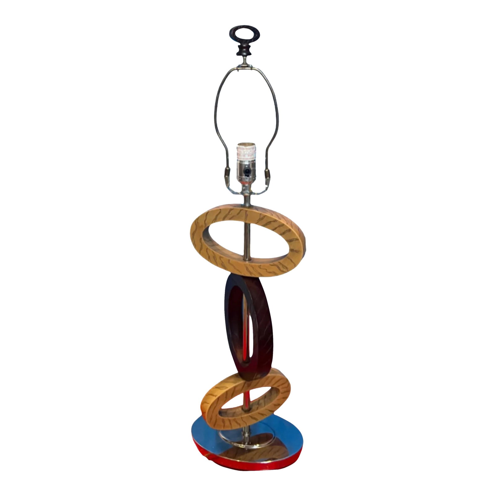 Vintage Balancing Elliptical Loop Table Lamp: This vintage geometric table lamp is a striking piece that combines artistry with functionality. Its design features a series of balancing resin ovals in varying sizes, creating a dynamic visual