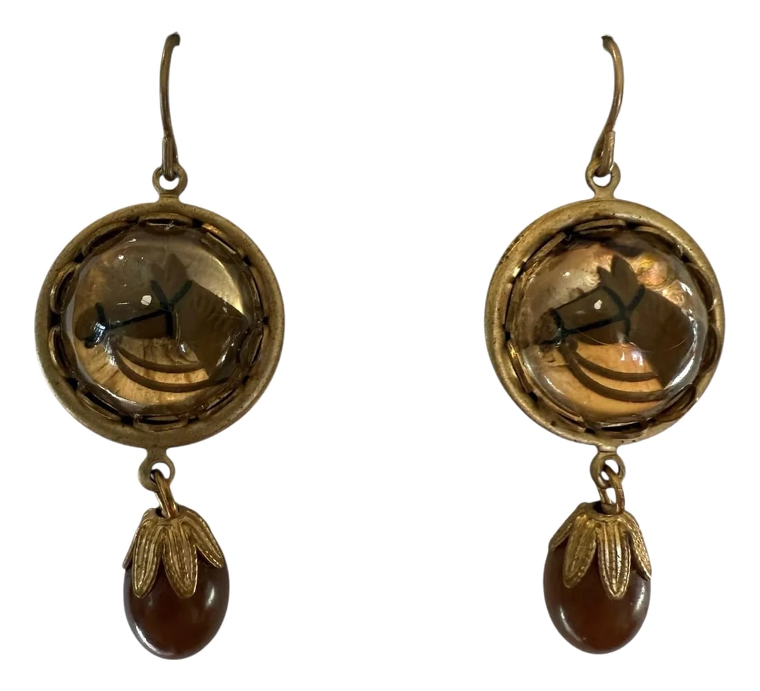1950s Victorian Revival Horse Essex Dangle Earrings, Set of 2: 1950's dangle earrings in the style of Essex jewelry of the Victorian and Edwardian era. An acrylic cabachon with a painted horse in bridle. Housed in cone shape brass. A brown plastic bead dangles