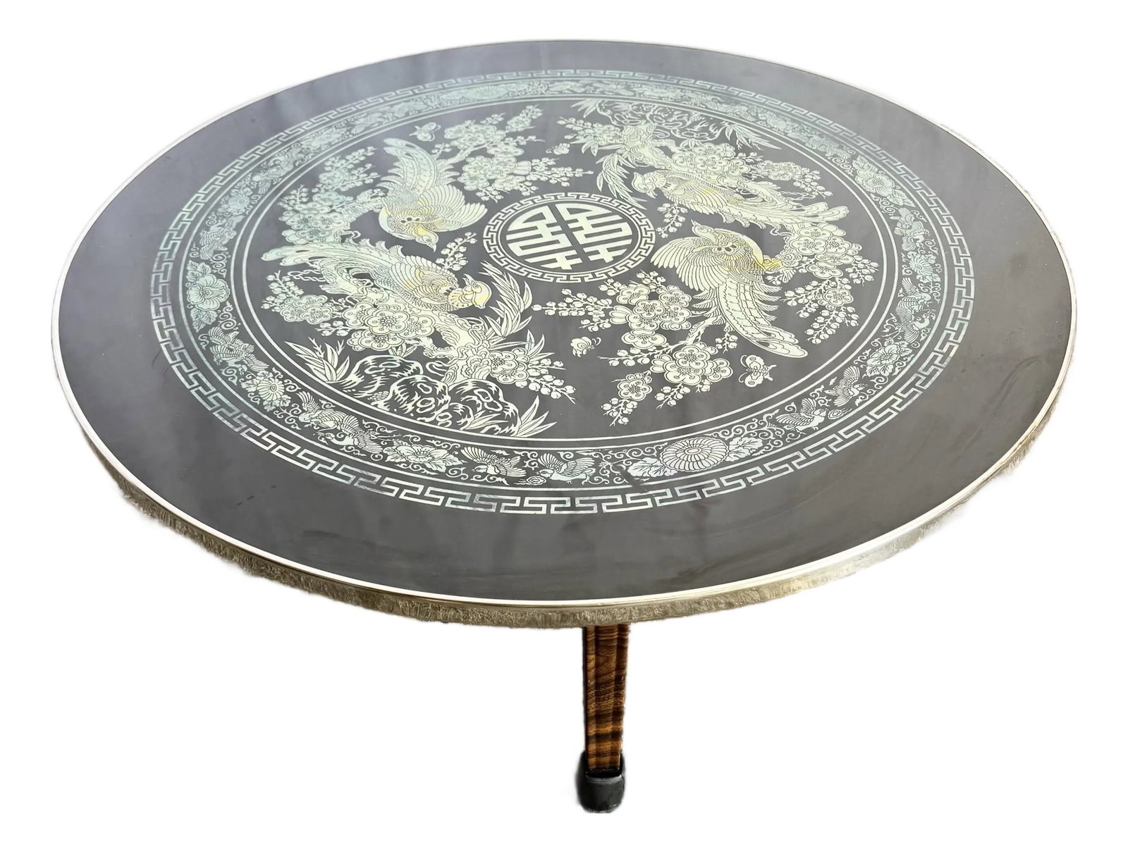 Vintage Korean Mother of Pearl Inlay Foldable Coffee Table: This vintage Korean coffee table features a stunning hand-inlaid mother of pearl design on a sleek black lacquer surface. The circular top showcases intricate depictions of phoenixes and floral