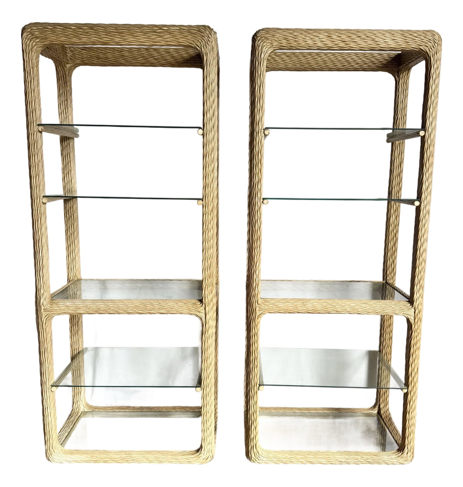 Vintage Boho Chic Twisted Wicker Etageres - A Pair: Elevate any coastal or bohemian interior with this exquisite pair of vintage twisted-wicker etageres. Crafted with sculptural, softly rounded frames, each piece showcases intricate braided wickerwork