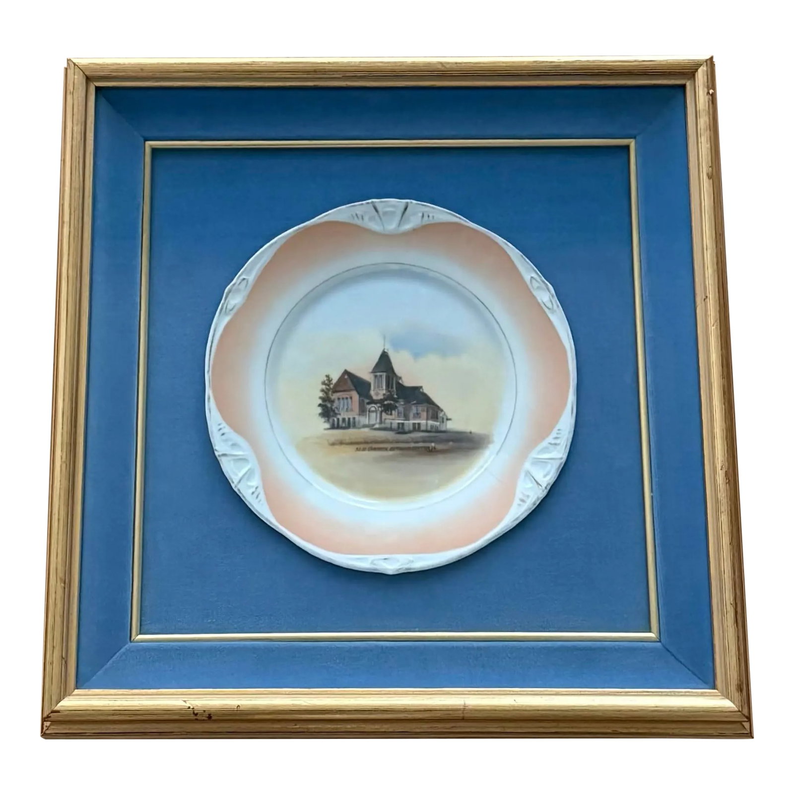 Framed Vintage Collector Plate: Framed vintage porcelain collector plate in the style of B.R.C. Racine featuring M.E. Church in Guthrie Center Iowa. The plate has a peach boarder and scalloped detail framed with beautiful blue