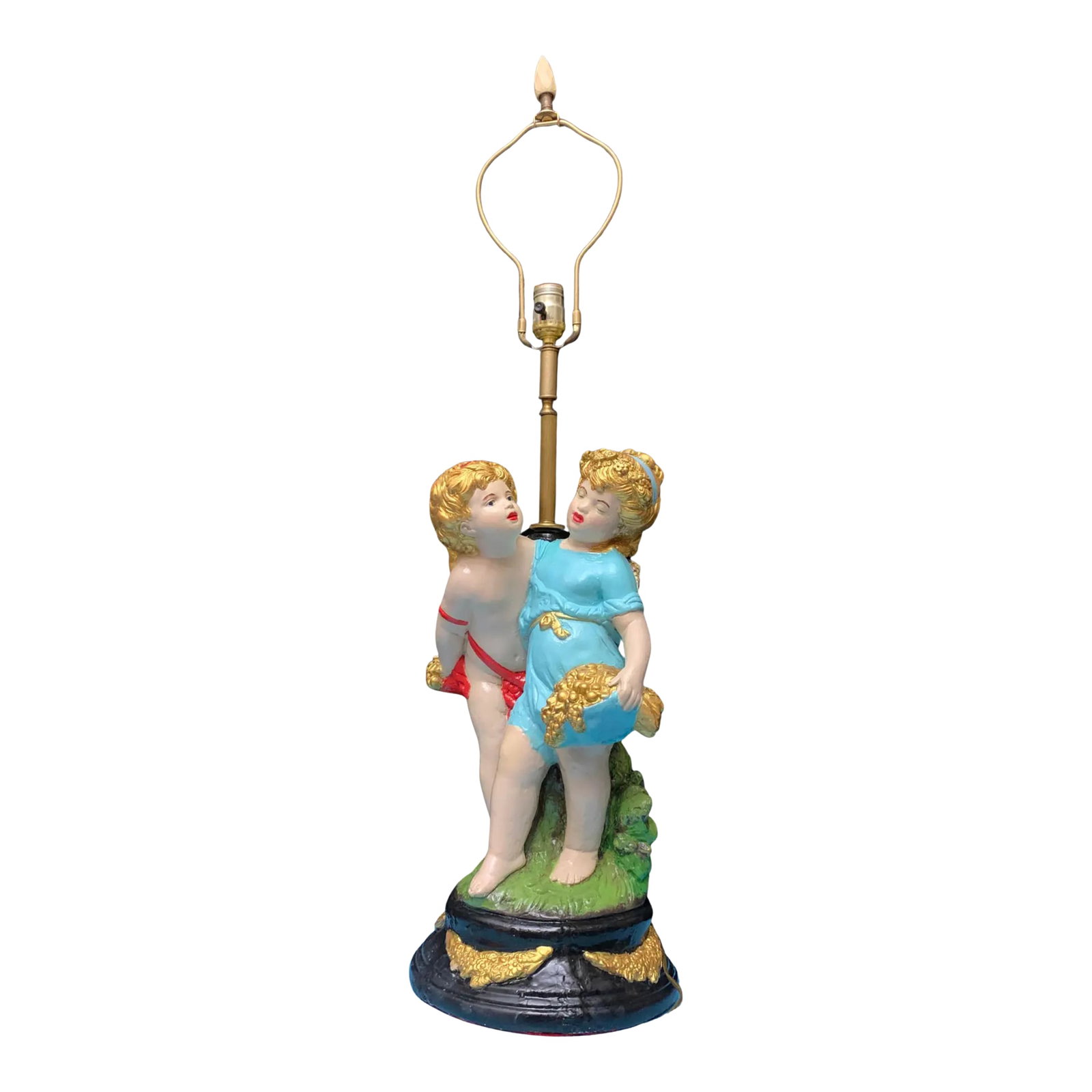 Mid-Century Chalkware Tender Cherubs Table Lamp: This mid-century Alexander Becker style chalkware lamp features a tender and emotionally rich scene between two cherubic children, capturing the innocence and shy affection of young love. The figures