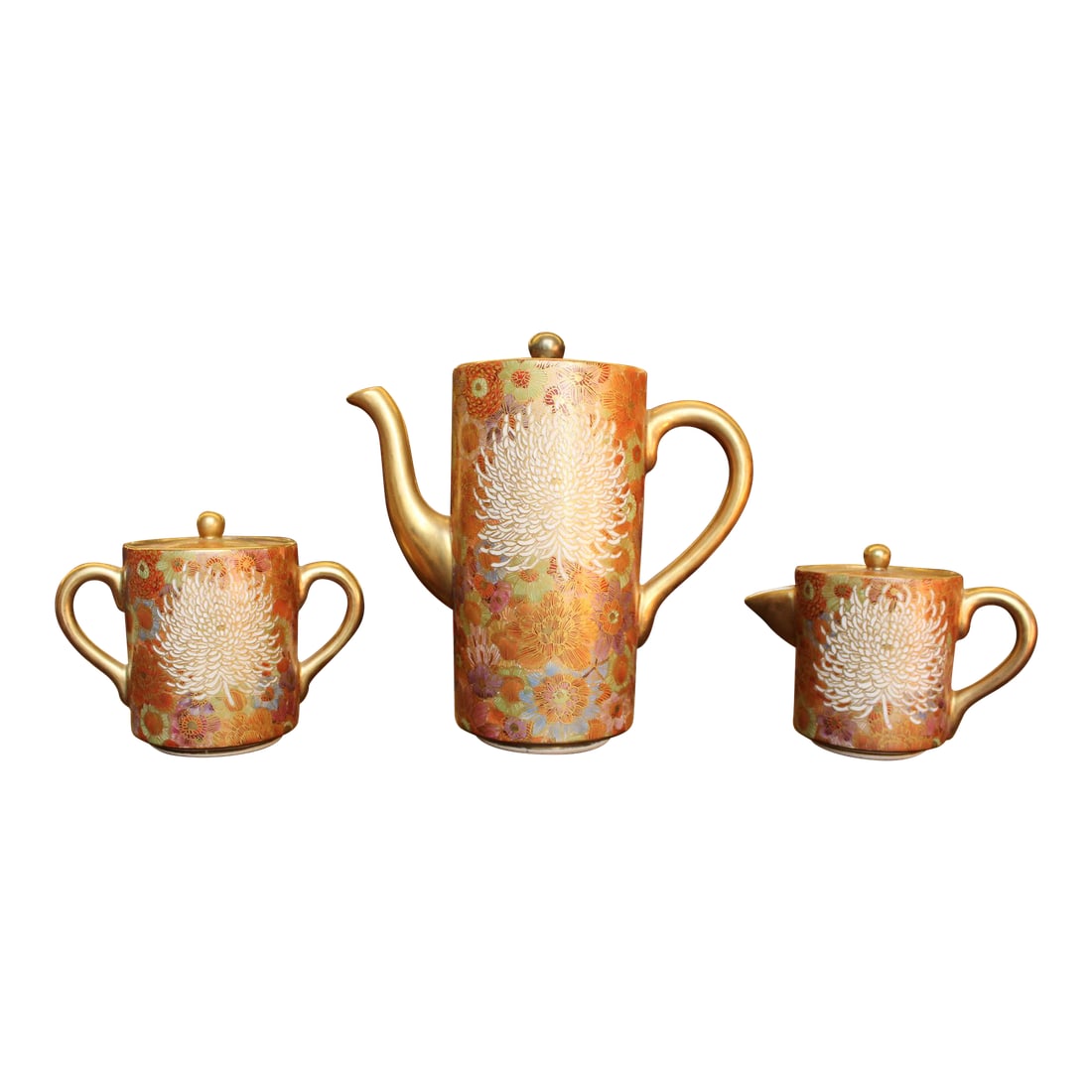 Mid 20th Century Elegant Golden Hand-Painted Satsuma 3-Piece Tea Set With Chrysanthemum and Multi/Ea: An excellent example of satsuma, in a tea set, gorgeously rendered in dimension and decoration. Presents in mint condition. Measurement field entries refer to teapot dimensions only. Please see