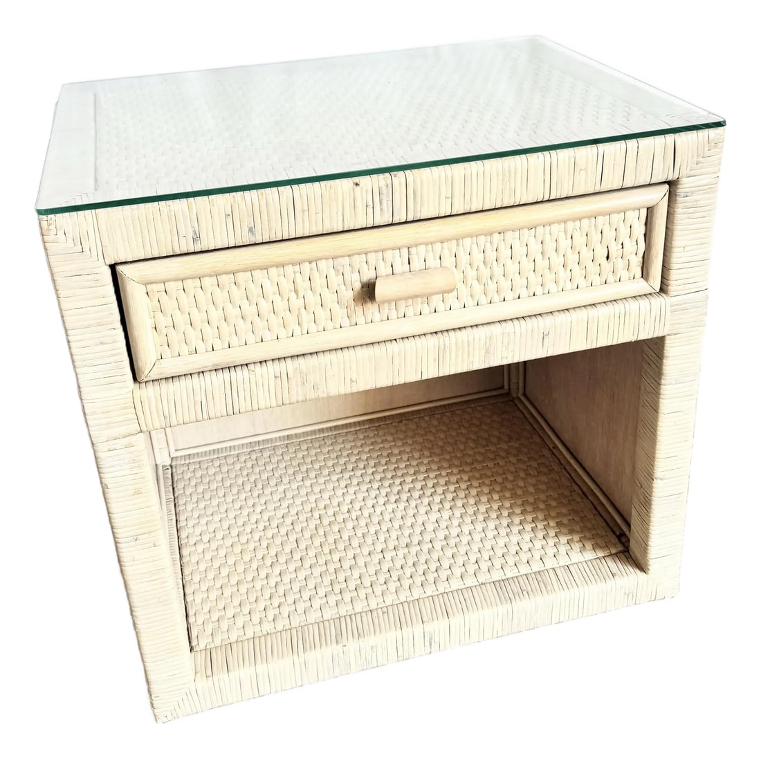 Boho Chic Wrapped Wicker Glass Top Nightstand: A charming Boho Chic wrapped wicker nightstand featuring a protective glass top over a woven surface, offering both durability and texture. The piece showcases a single woven drawer with a simple