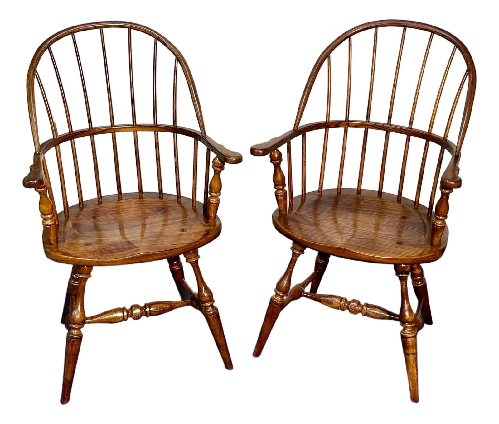 1980s Fredrick Duckloe Sack Back Windsor Chairs, a Pair: Own a piece of living history with these masterfully crafted Sack-Back Windsor Chairs made by Fredrick Duckloe Brothers of Portland Pennsylvania, an enduring icon of American design that seamlessly