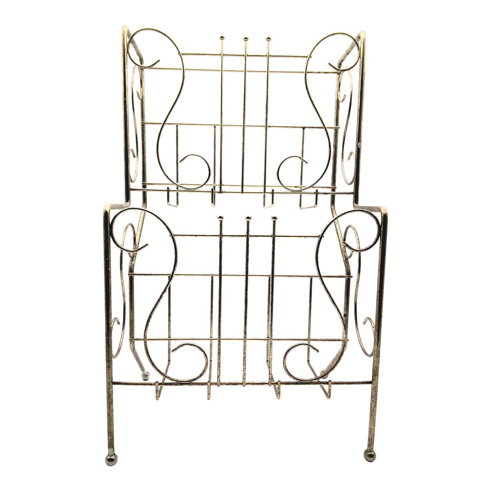 Large Vintage Brass Magazine / Record Vinyl Holder: This vintage Mid-Century Modern wire magazine rack features a gold-tone finish, balled feet, and ornate scrollwork. Design: Designed to hold large format magazines and periodicals. Usage: Popular as