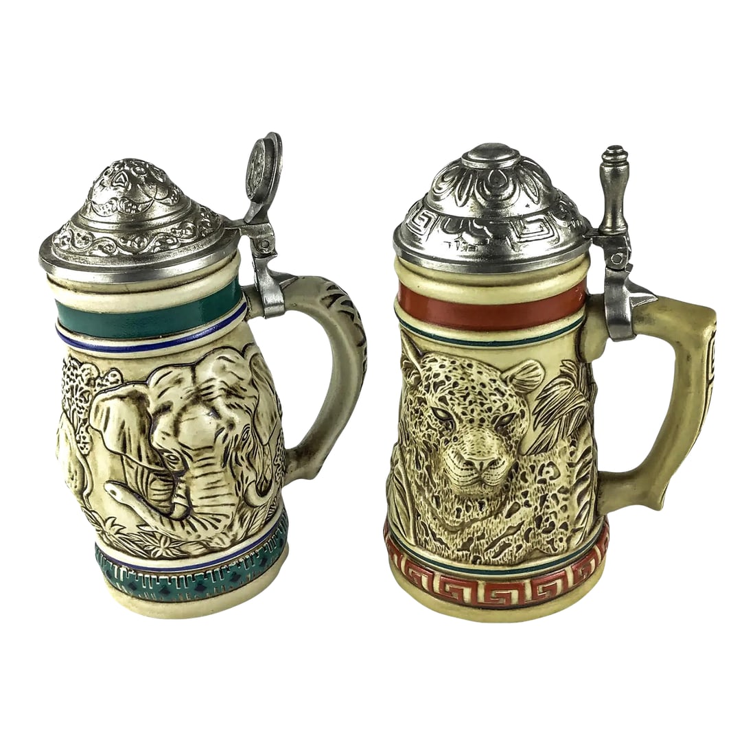 Ceramarte Brazil Beer Steins by Avon - A Pair: Pewter covers and a theme embracing endangered species this pair of steins is perfect for animal lovers or beer drinkers. Small in size, never used and very beautiful workmanship. Here we have the