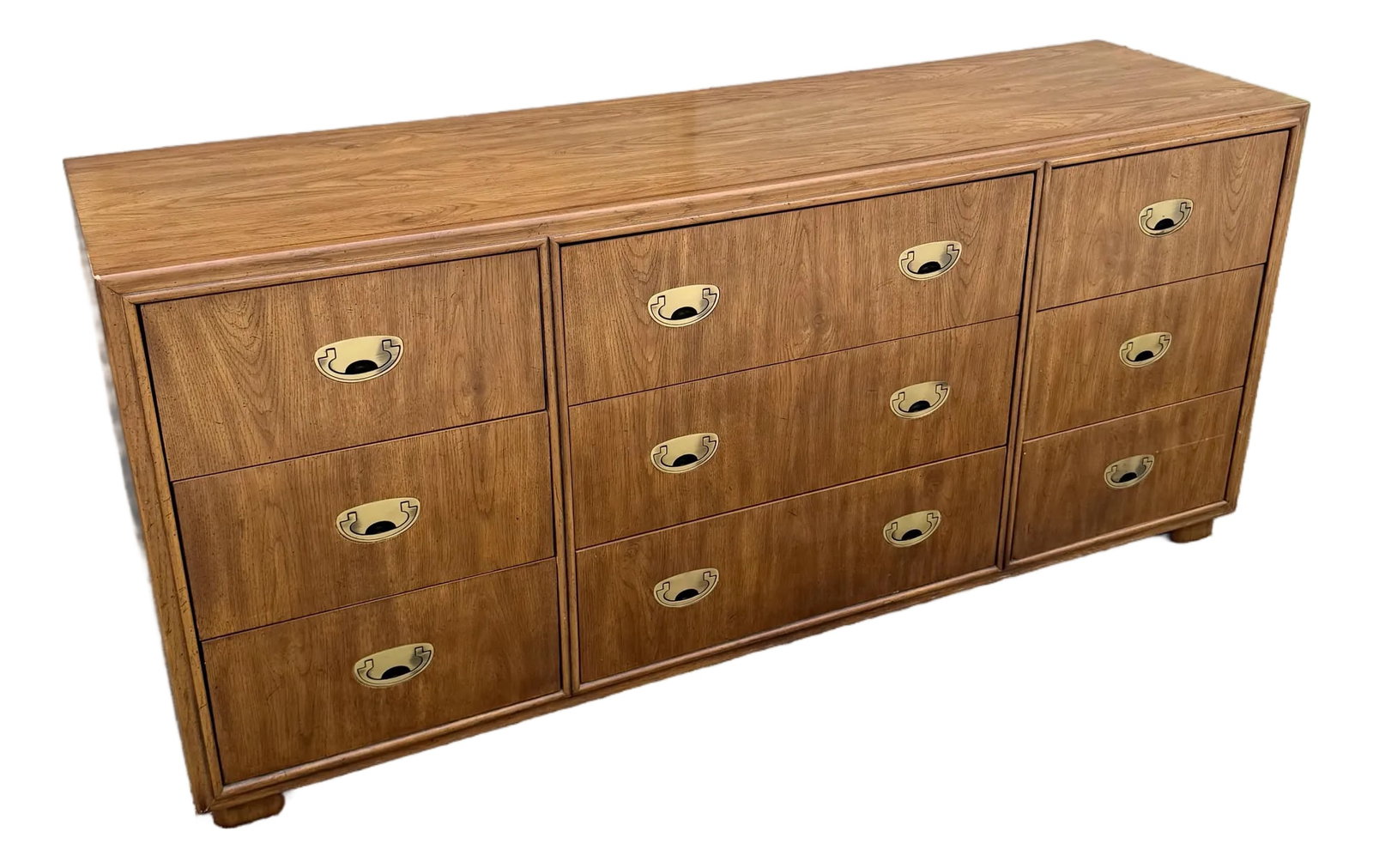 Drexel "Passages" Campaign Style Dresser: A handsome vintage dresser from Drexel's Passages collection, featuring a warm walnut finish and classic Campaign-inspired recessed brass hardware. The elongated case offers nine spacious drawers