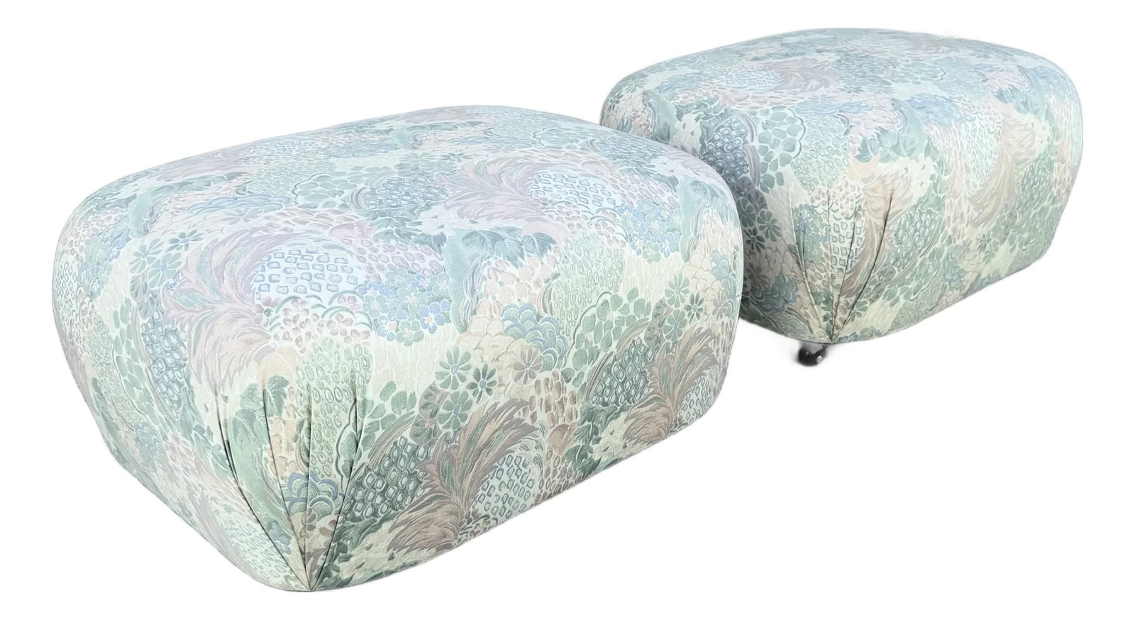 Postmodern Multicolored Floral Fabric Pouf Ottomans - A Pair: Wrapped in a whimsical pastel floral upholstery, this pair of vintage postmodern ottomans brings playful character and soft sculptural form to any interior. Their rounded, pebble-like silhouettes