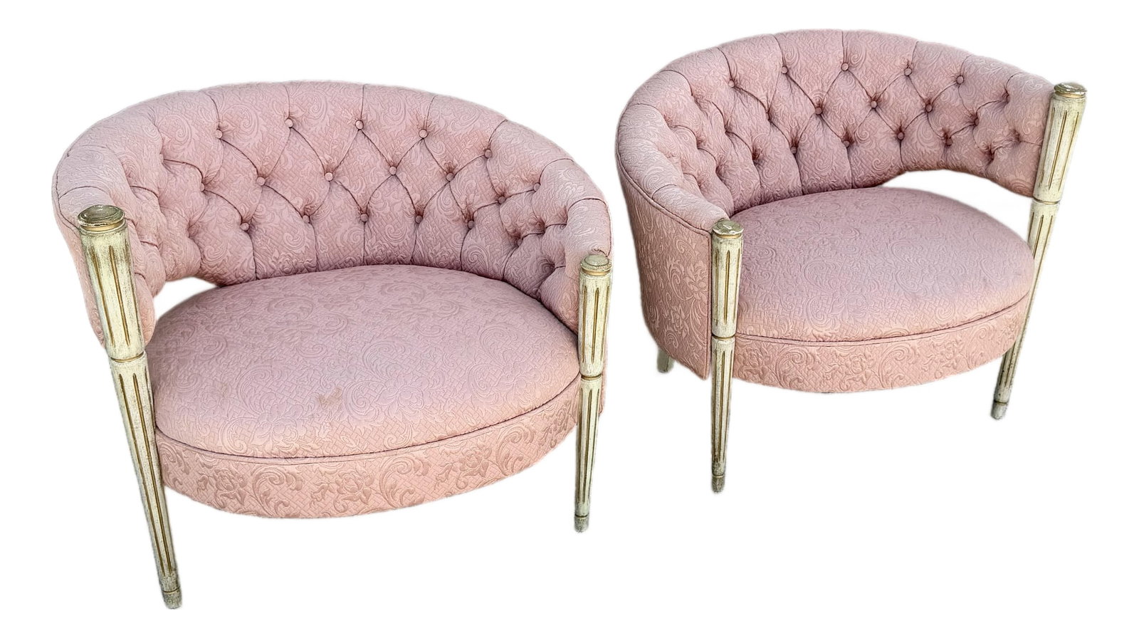 Vintage French-Style Tufted Pink Barrel Accent Chairs - A Pair: Glamorous pair of vintage French-inspired barrel chairs featuring softly curved silhouettes upholstered in blush pink patterned fabric. Deep diamond button tufting wraps around the interior backs,