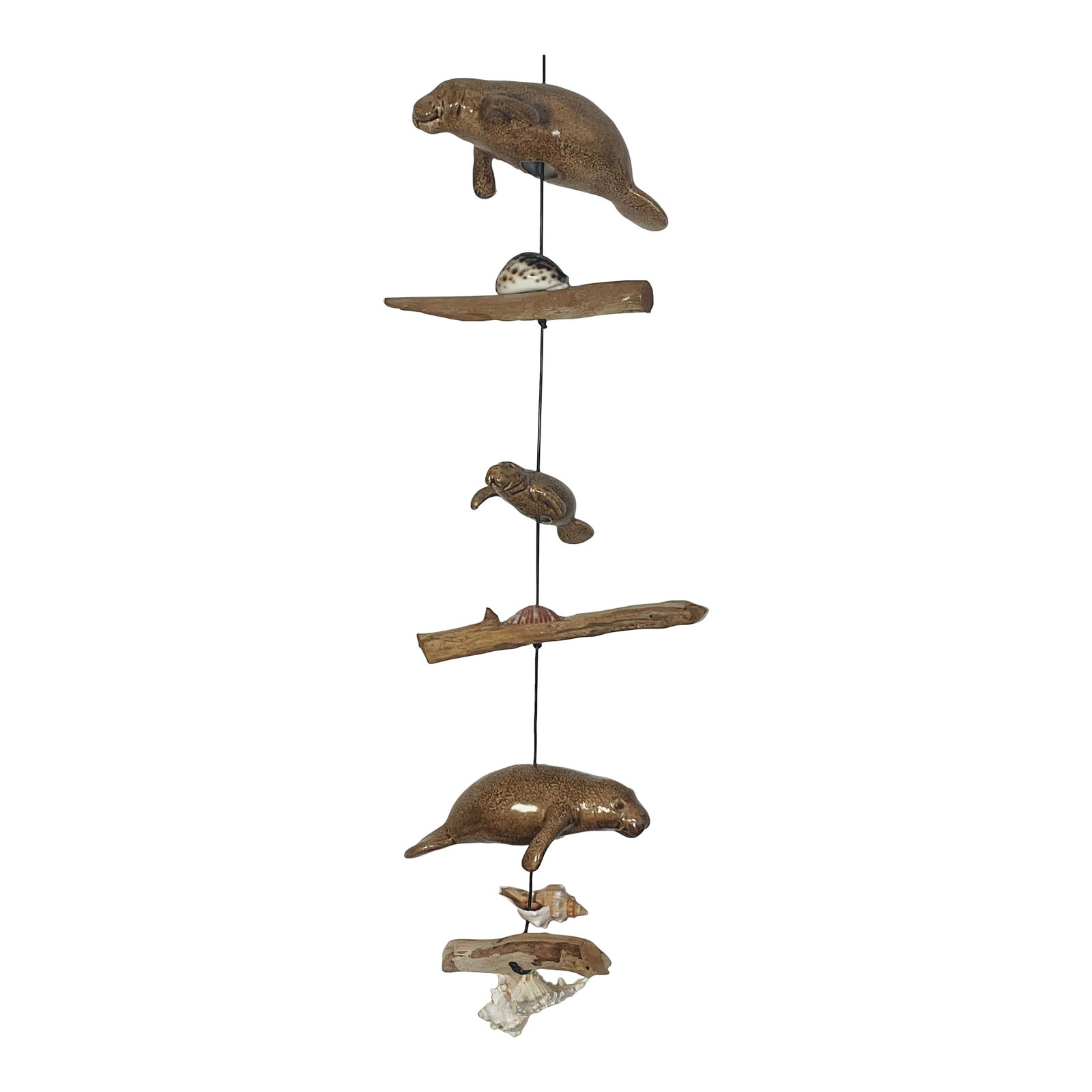 1960s Florida Coastal Sea Shells Manatee Mobile Sculpture: Cute Florida coastal mobile sculpture with ceramic manatee figures, sea shells and driftwood pieces. Condition: Alterations: Original Condition Unaltered Imperfections: Some Imperfections Condition No
