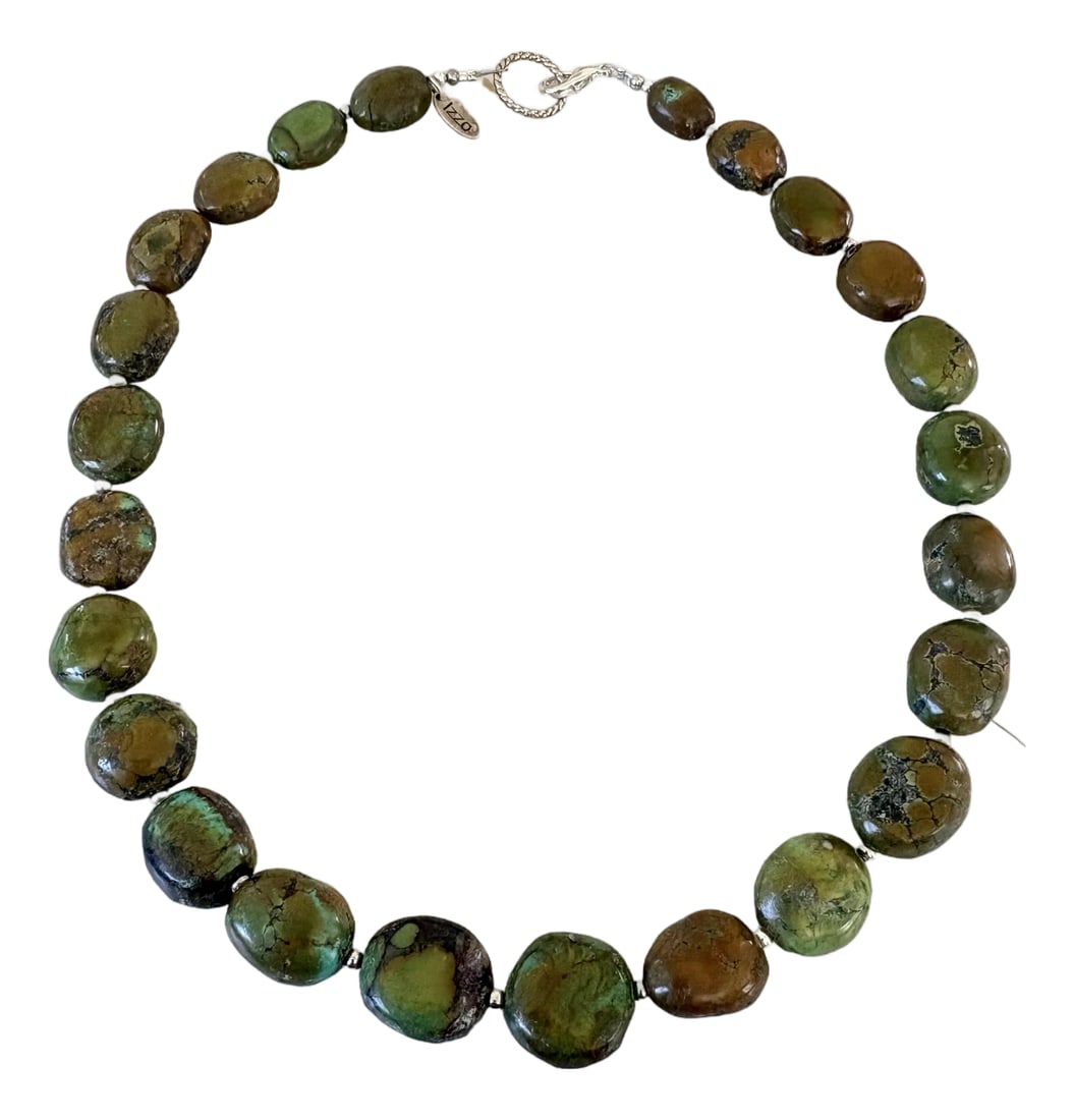 Green Natural Turquoise Beaded Necklace With Silver Spacers.: The Izo green natural turquoise chunky graduated necklace features polished, earthy green and brown matrix gemstone nuggets separated by small silver spacer beads and finished with a toggle clasp.