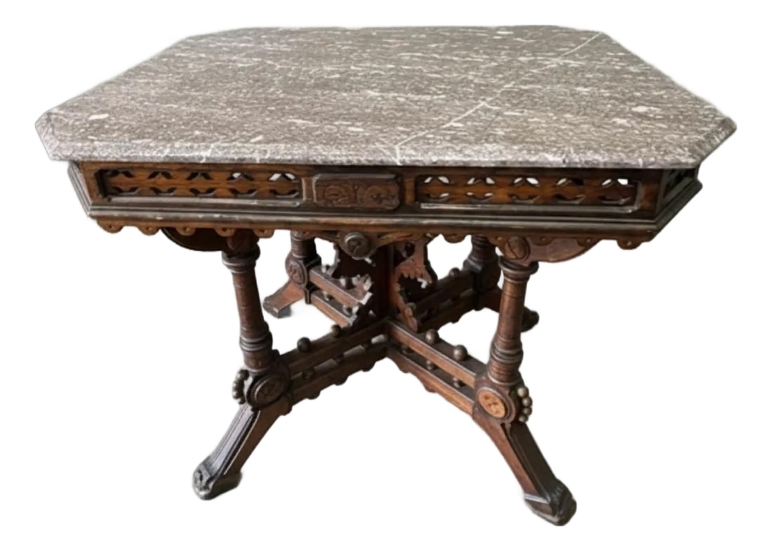 19th Century Victorian Eastlake Carved Walnut Octagonal Center Table With Rouge Marble Top: Bring late 19th-century elegance into your space with this exceptional American Victorian Eastlake center parlor table, circa 1880. Masterfully crafted from solid walnut, this piece perfectly