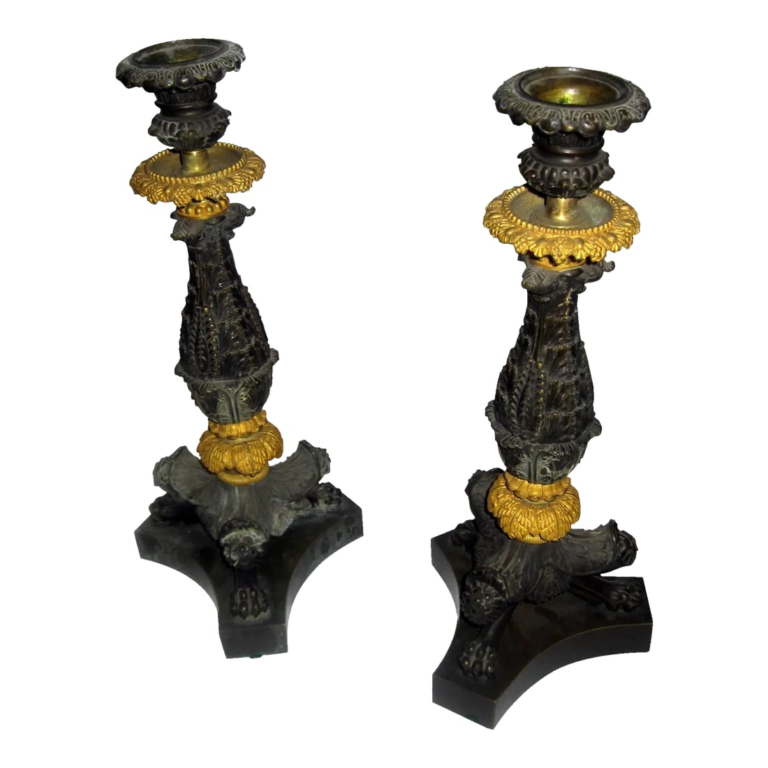 19th century Charles 'X' French Gilt and Patinated Bronze Candlestick, Pair - A Pair: Features include superb detail with gold gilding and bronze patination. They are intricately sculpted with fanciful designs, acanthus leaves and grape clusters with three claw feet resting on a