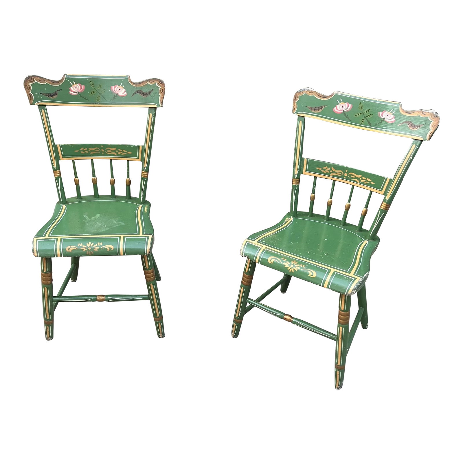 Pair of Mid 20th Century Green Pennsylvania Folk Art Chairs: Pennsylvania Dutch pair. Pink floral accents on backrest. Elegant gold design trim. In good vintage condition with slight wear normal for age Condition: Alterations: Original Condition Unaltered