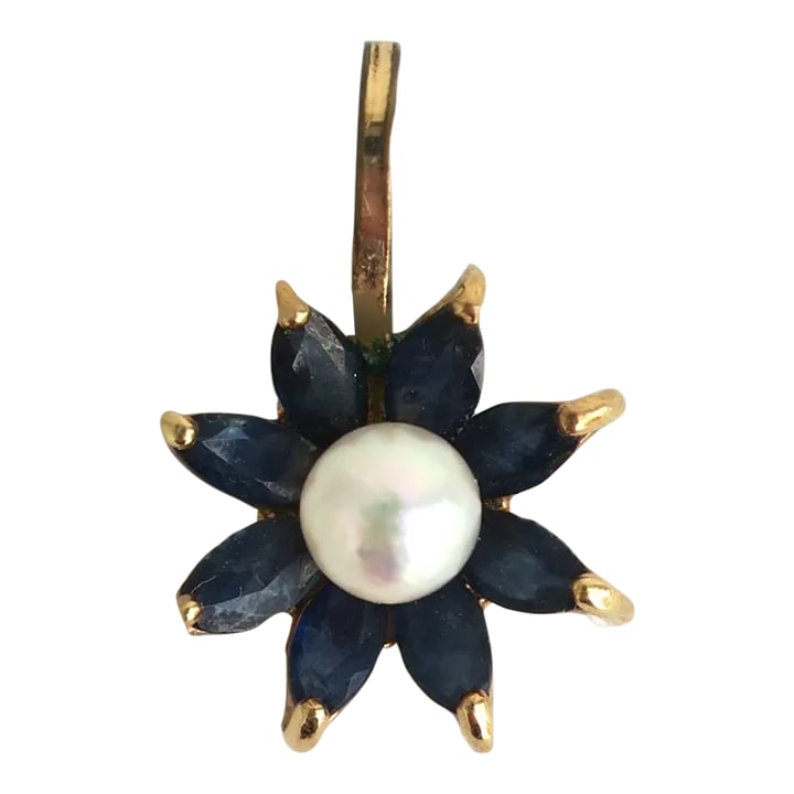 Pearl and Sapphire 14 Karat Gold Charm Pendant: This is part of Chairish's Fine Jewelry assortment. A fun charm pendant in a flower design; a white cultured pearl center, marque shaped blue sapphires as petals, beautifully set in 14-karat yellow