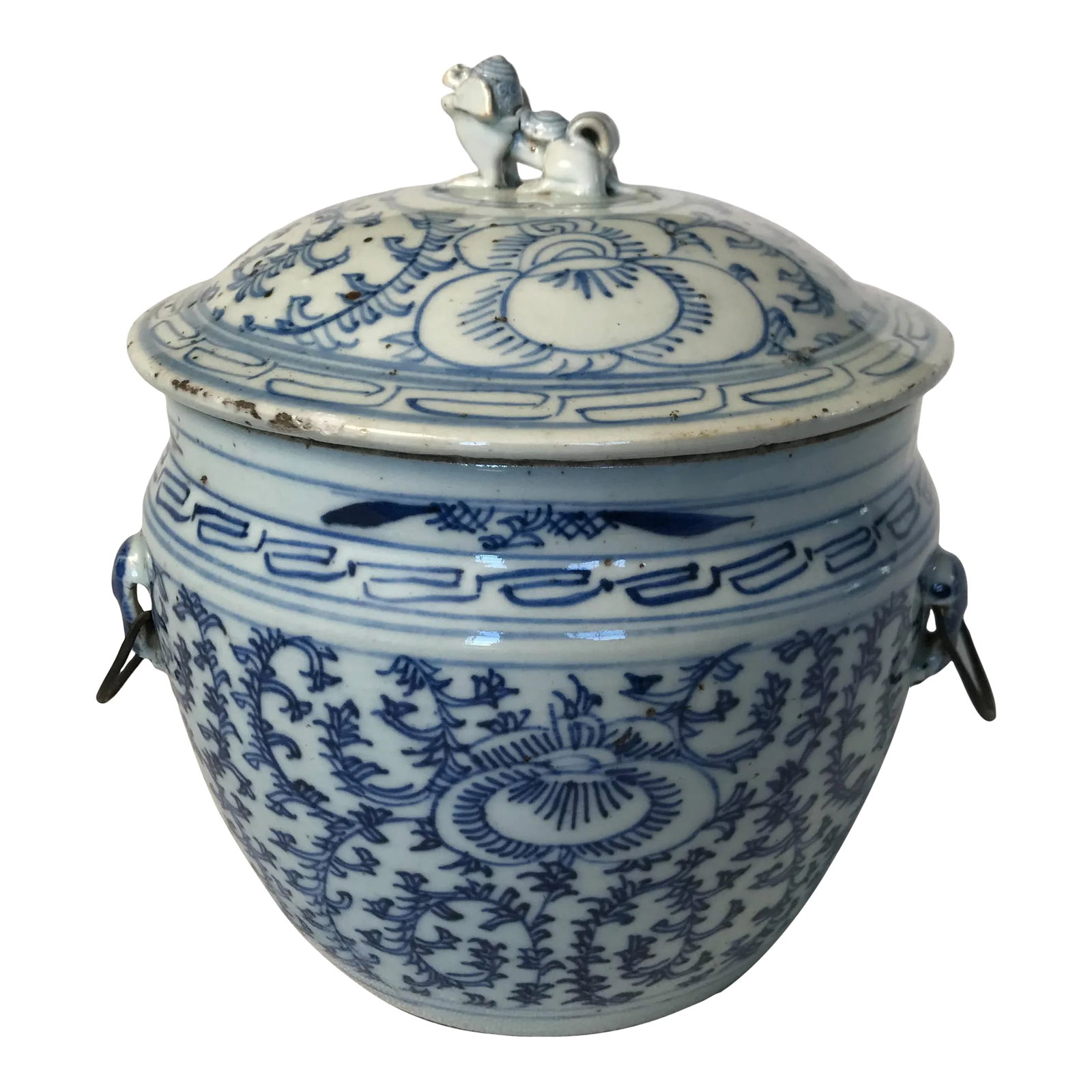 Tongzhi Era C.1870 Foliate Decoration Covered Porcelain Ginger Jar, Iron Handles on the Sides and Fo: Tongzhi Era, circa 1870 having foliate decoration covered porcelain ginger jar. Iron handles on the sides and a foo dog ceramic handle on the lid. Firing imperfections consistent with period. Conditio