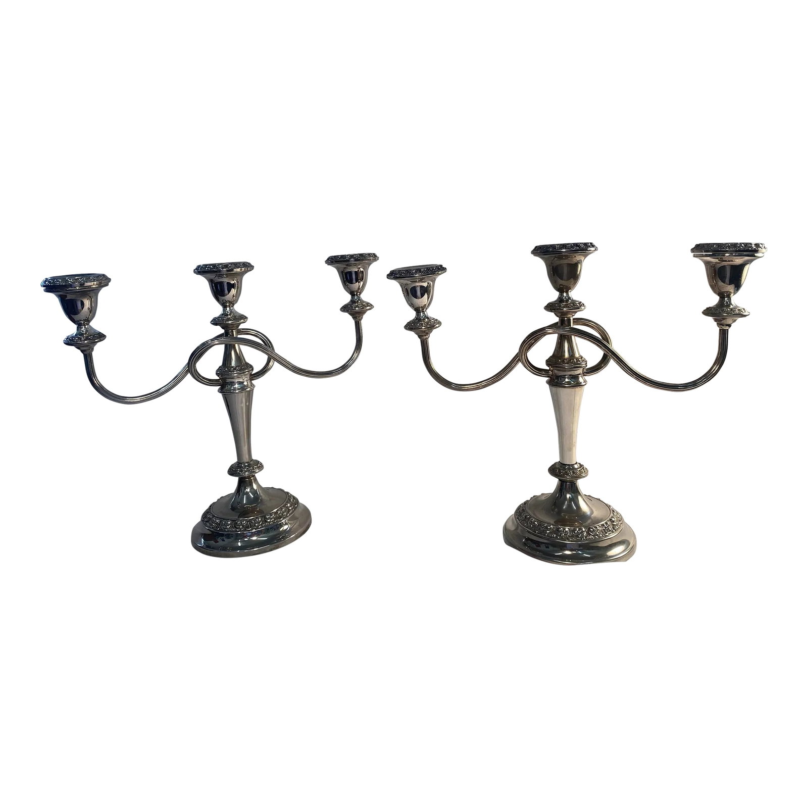 Pair of Antique English Candelabras C. 1910-1920: Antique candelabras would have been used throughout the house as lighting in every room. They would adorn various places in the house including dining tables, during meals, mantlepieces, throughout th