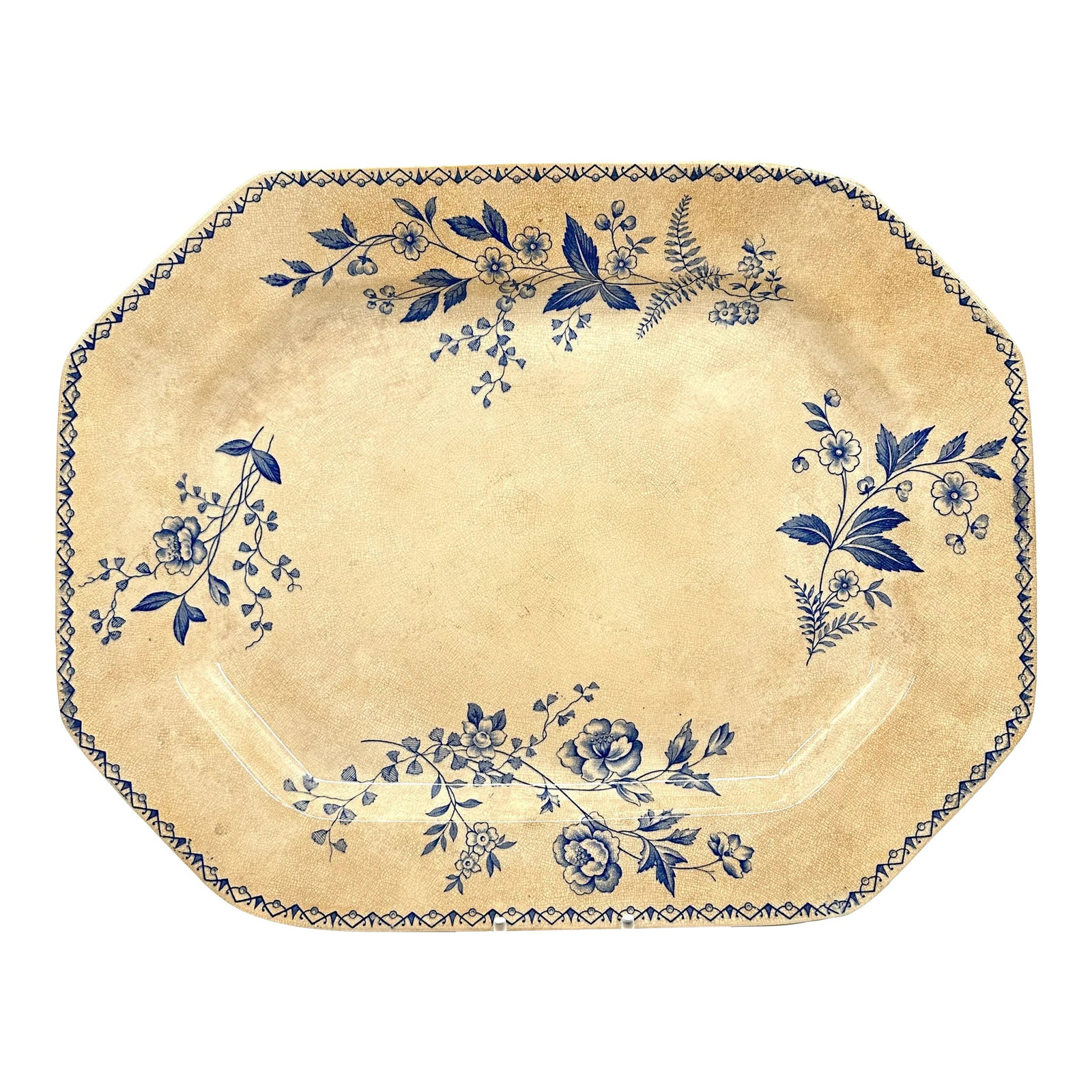 Antique Persian Serving Platter Blue Floral: Beautiful antique cream and ink blue serving platter. Hand painted floral designs on the front, with a geometric border. Gorgeous crackling glaze across the platter. Makers mark on the bottom reads: