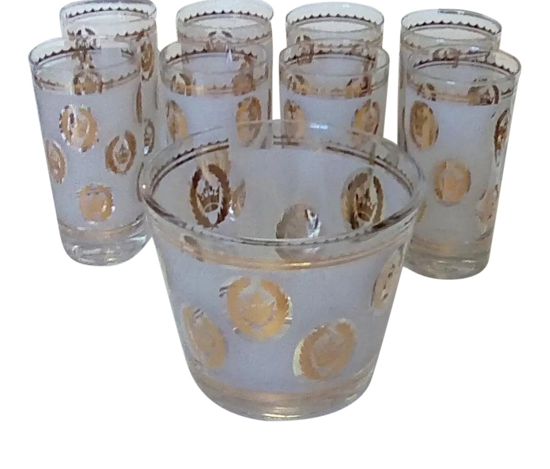 1960's Mid-Century Modern G. Reeves Drinking Glasses and Ice Bucket- 9 Piece Set: Designed by G. Reeves, these 22 karat gold highball drinking glasses are a must have and add class to your bar or executive office. A set of 8 glasses with matching ice bucket each individually signed