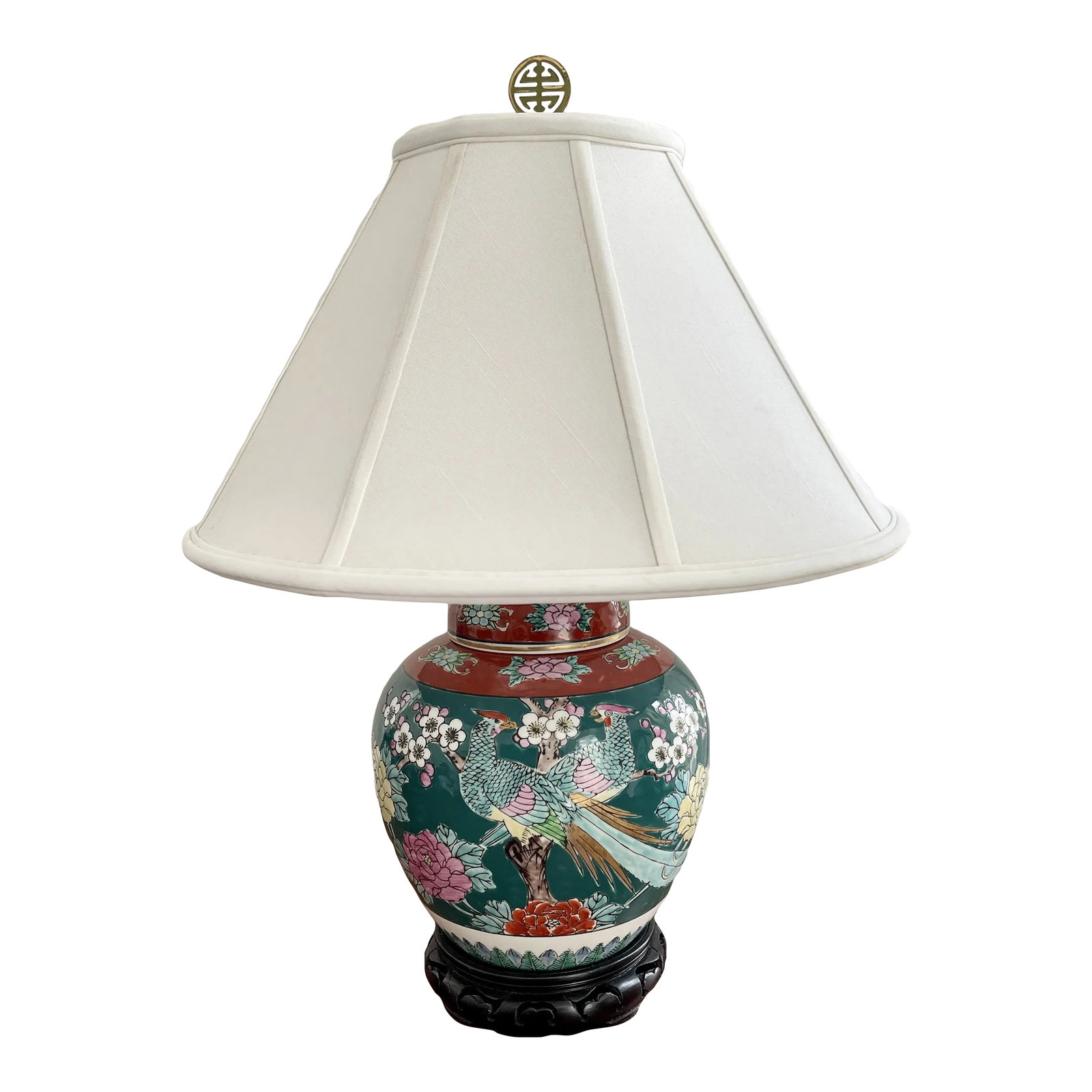 Vintage Imari Ginger Jar Table Lamp: Beautiful emerald green, burnt orange, pink, yellow and gold Imari ginger jar converted to a table lamp. Lotus flowers, cherry blossoms, and peacocks adorn this lovely lamp. Beautiful carved ebony bas